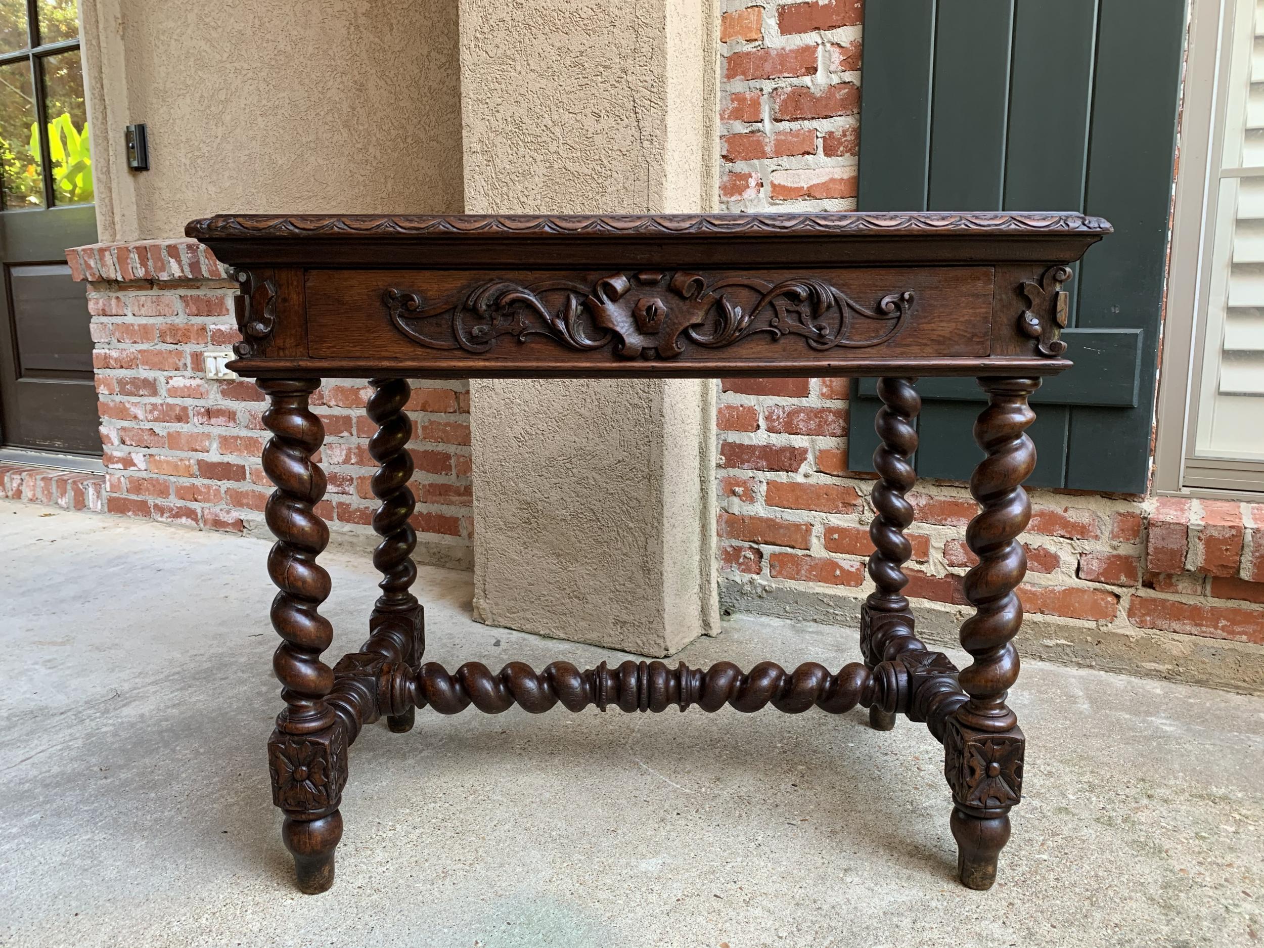 19th century French carved oak sofa table writing desk barley twist Louis XIII style

~ Direct from France
~ Beautiful French writing desk or sofa table with elegant features!
~ Lovely barely twist legs as well as barley twist stretcher and