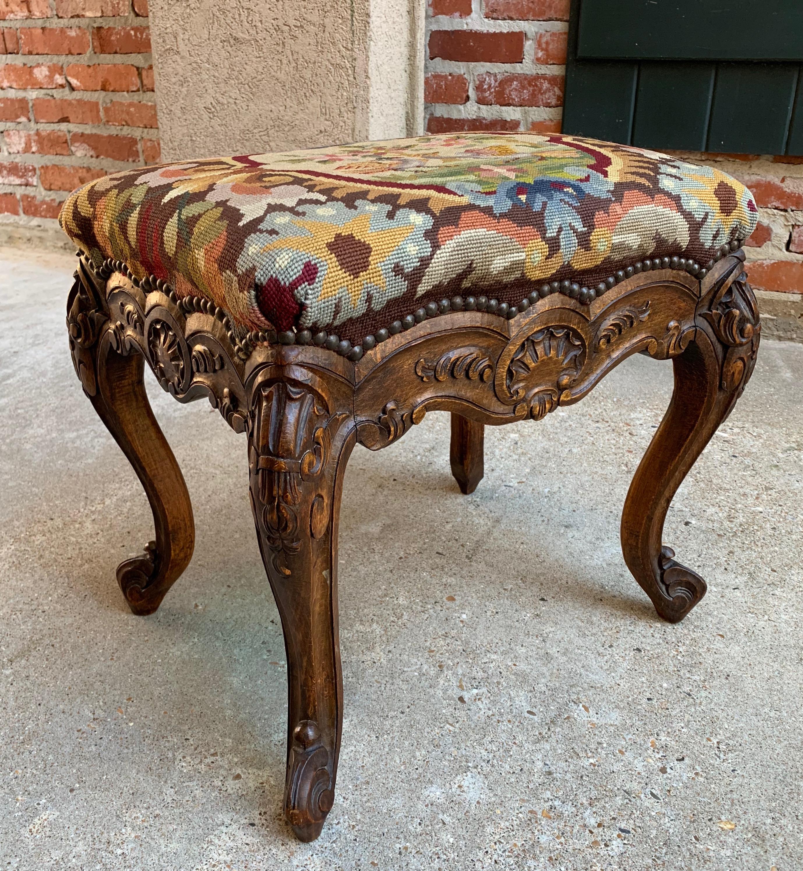 Direct from France, one of several great antique stools, tabourets, and benches from our most recent container!
~ Fabulous French Louis XV style with cabriole legs and hand carved apron on all sides.
~ Lovely French upholstery, with large brass