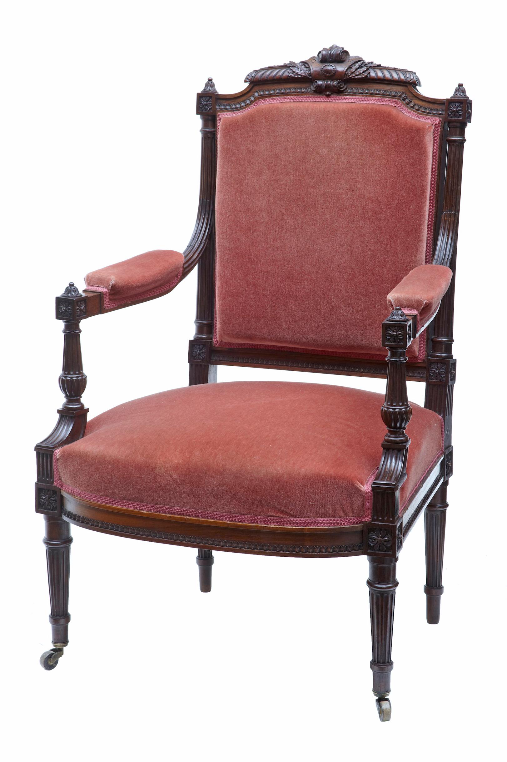 Beautiful carved solid rosewood armchair, circa 1870.

Finely carved back rest of the highest standard, fluted arms lead to the arm rest cushions. Arms supported by turned supports, and further carving to the rail. Standing on fluted legs with