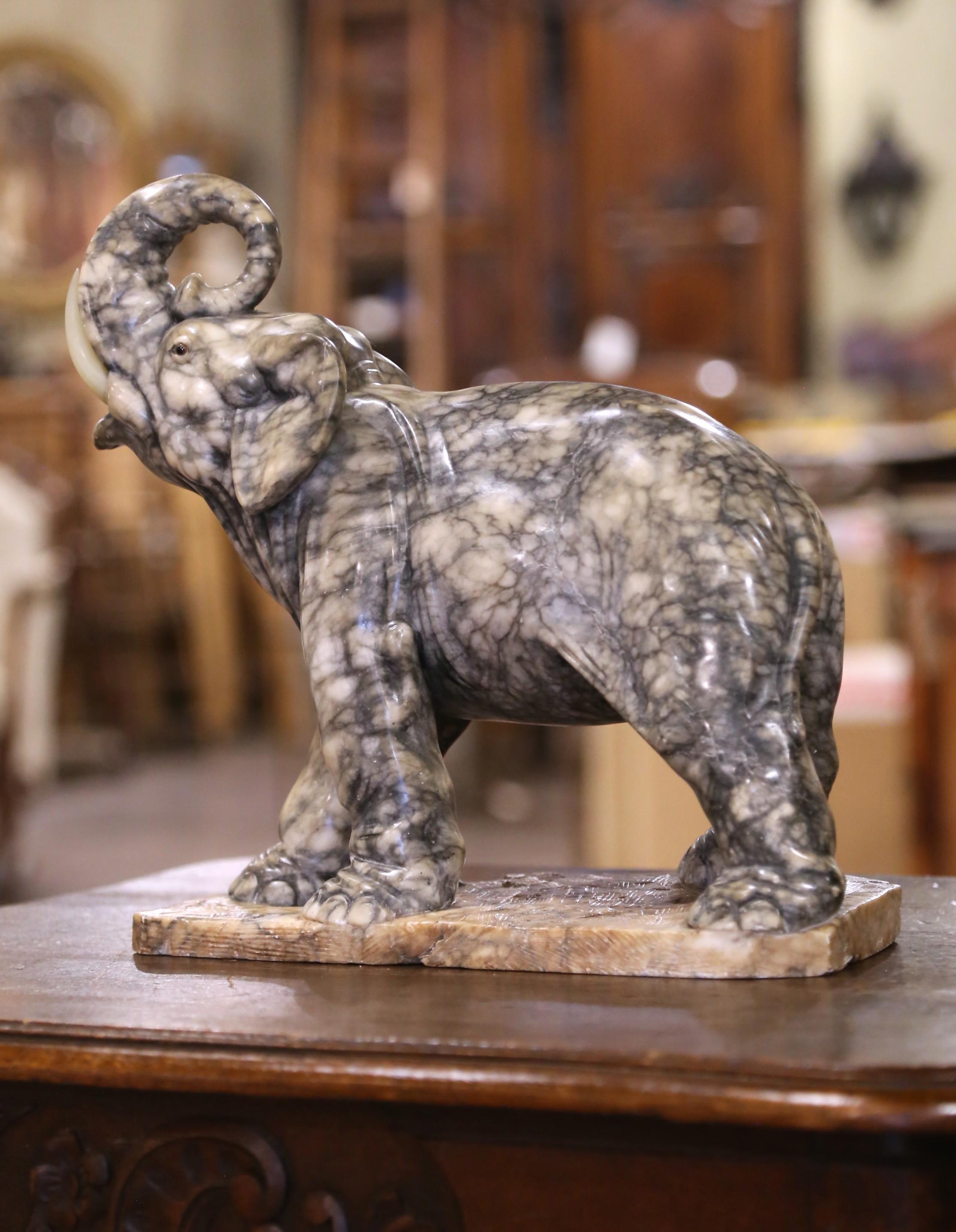 Francese 19th Century French Carved Variegated Marble Elephant with Raised Trunk in vendita