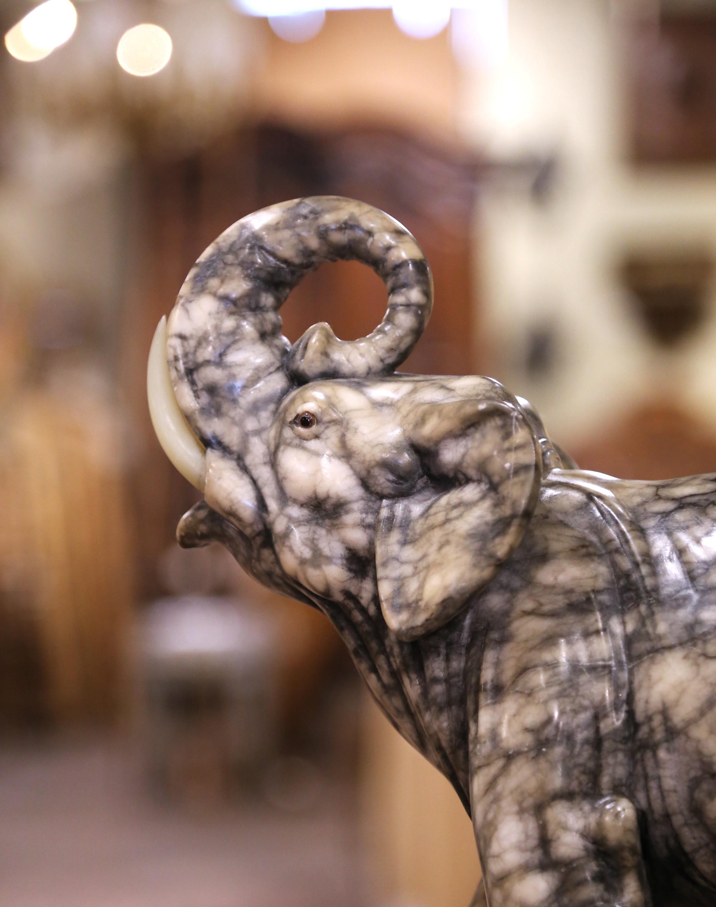 Fatto a mano 19th Century French Carved Variegated Marble Elephant with Raised Trunk in vendita