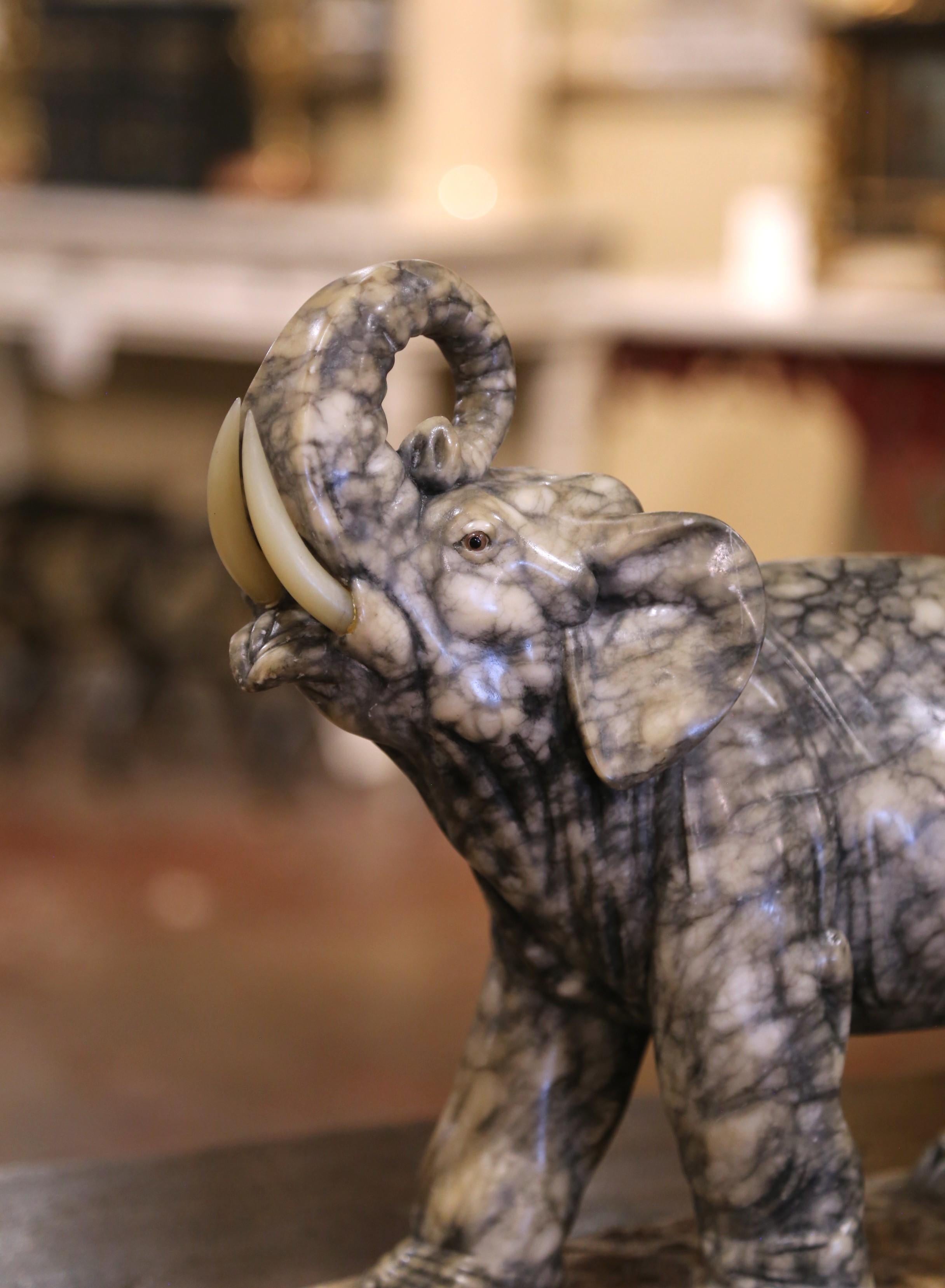 XIX secolo 19th Century French Carved Variegated Marble Elephant with Raised Trunk in vendita