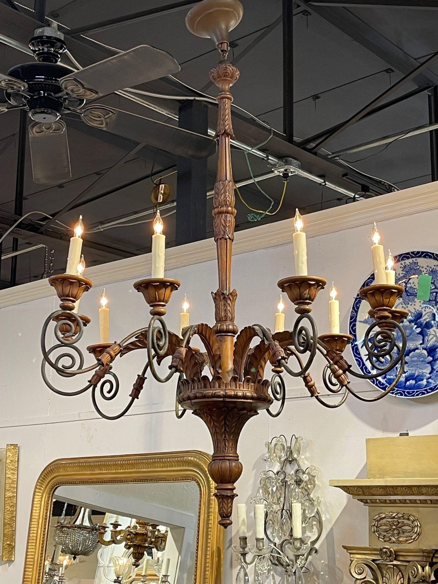 Beautiful 19th century French carved walnut and iron 10 light chandelier. Very fine intricate carving and nice patina. Makes an elegant statement!