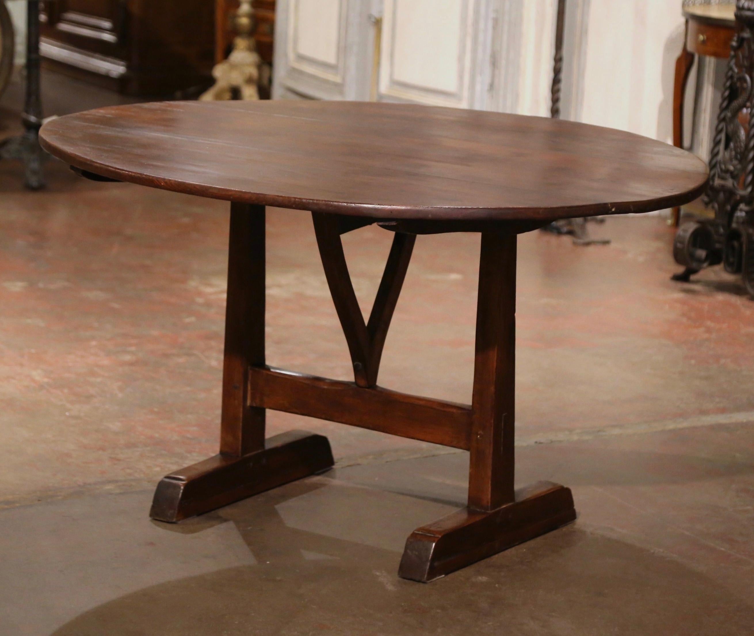 Country 19th Century French Carved Walnut and Pine Oval Tilt-Top Wine Tasting Table For Sale
