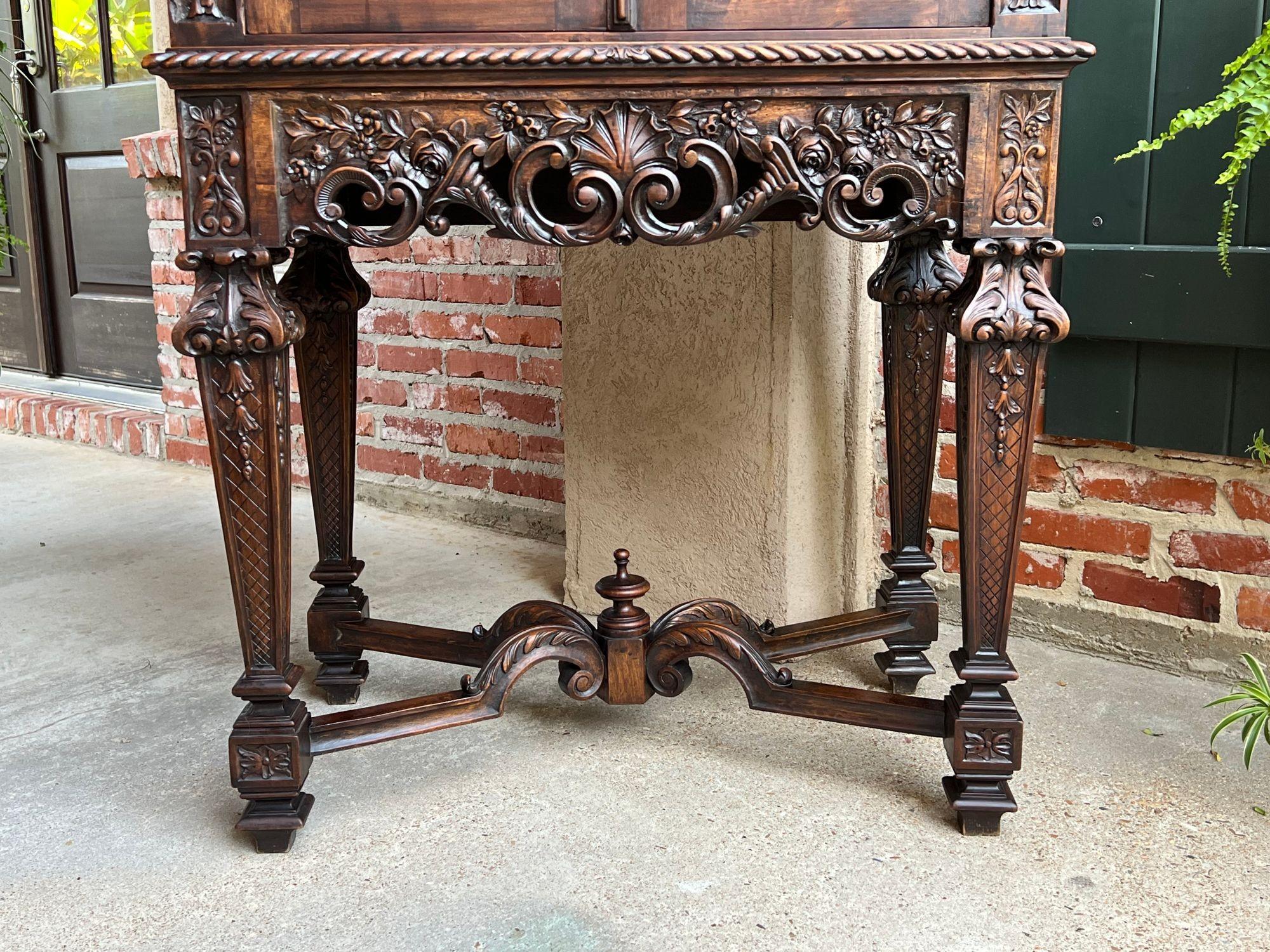 19th century French Carved Walnut Cabinet Bar Renaissance Wine Server Baroque.
 
 Direct from Europe, a highly carved antique cabinet, with a drop down back, which perfectly adapts for a wine/liquor cabinet! However, the story here should really be