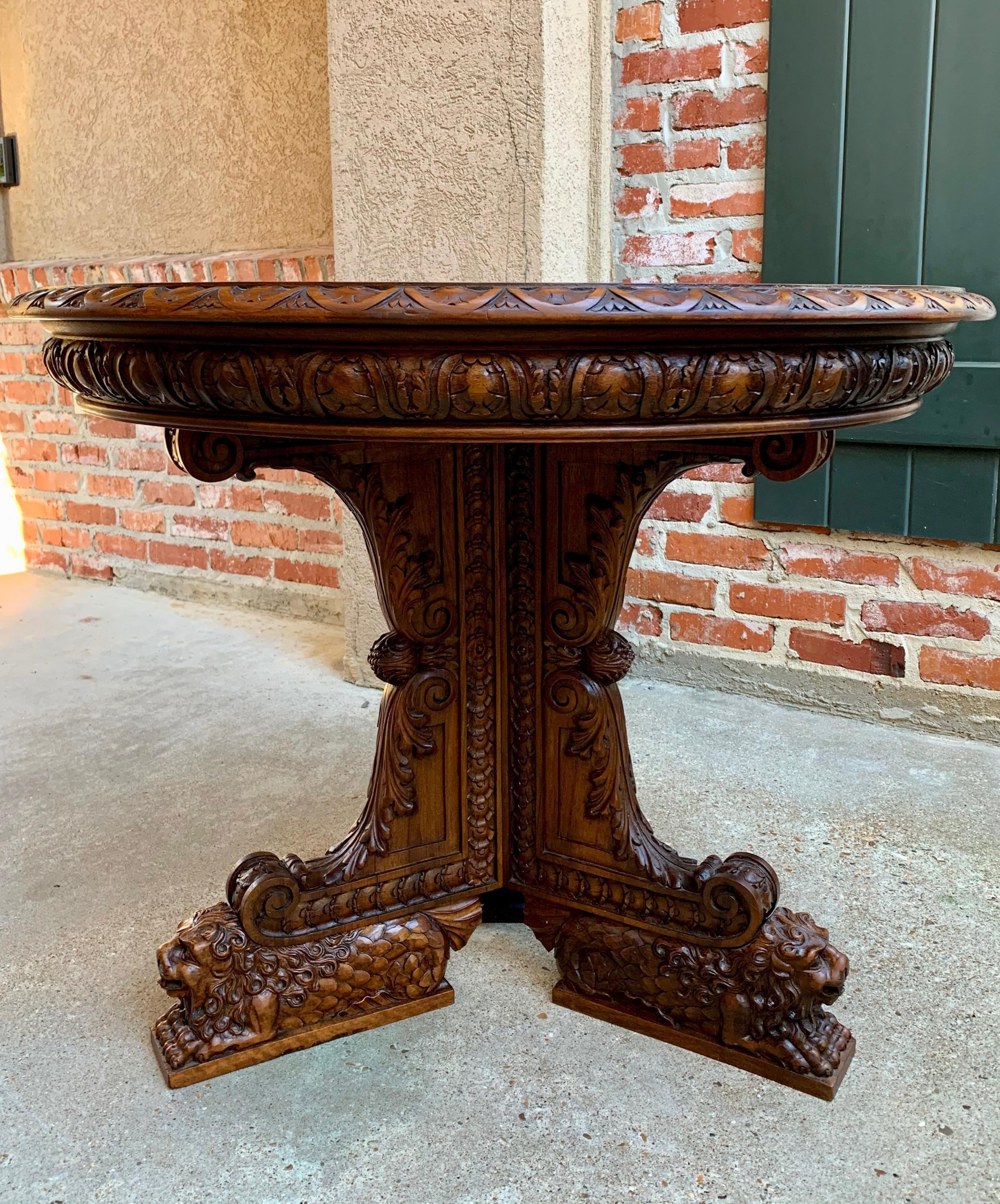19th century French carved walnut center table round Foyer Lion Louis XIV style

~Superb antique French center table, obtained with the purchase of the ENTIRE contents of a French estate!~
~Breathtaking details…each of the legs is supported by a