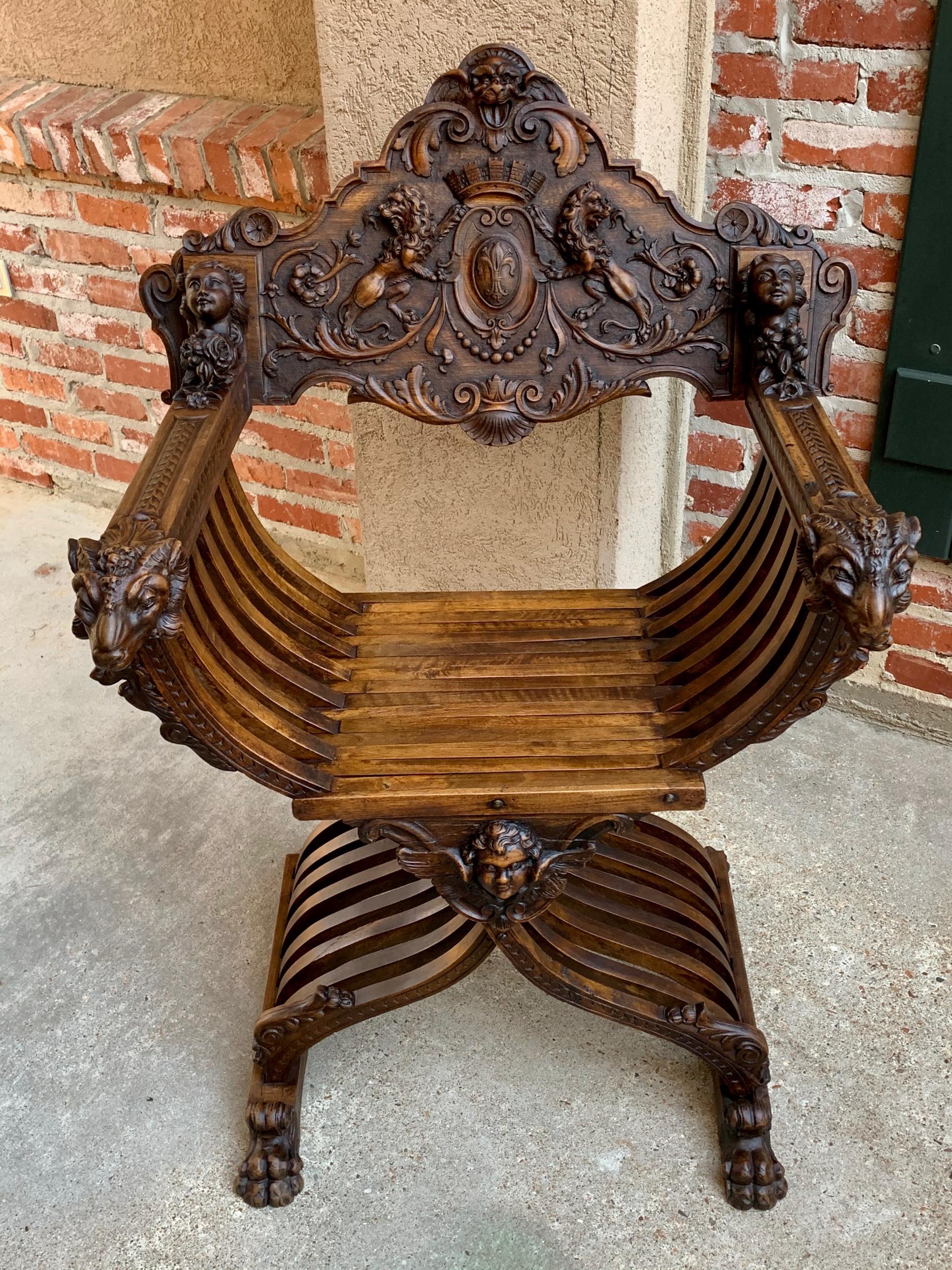 19th century French carved walnut Dagobert curule chair arm throne renaissance

~Direct from France~
~Stunning antique carved “Dagobert” chair with beautifully detailed hand carvings from top to bottom.~
~The dagobert throne chair or curule