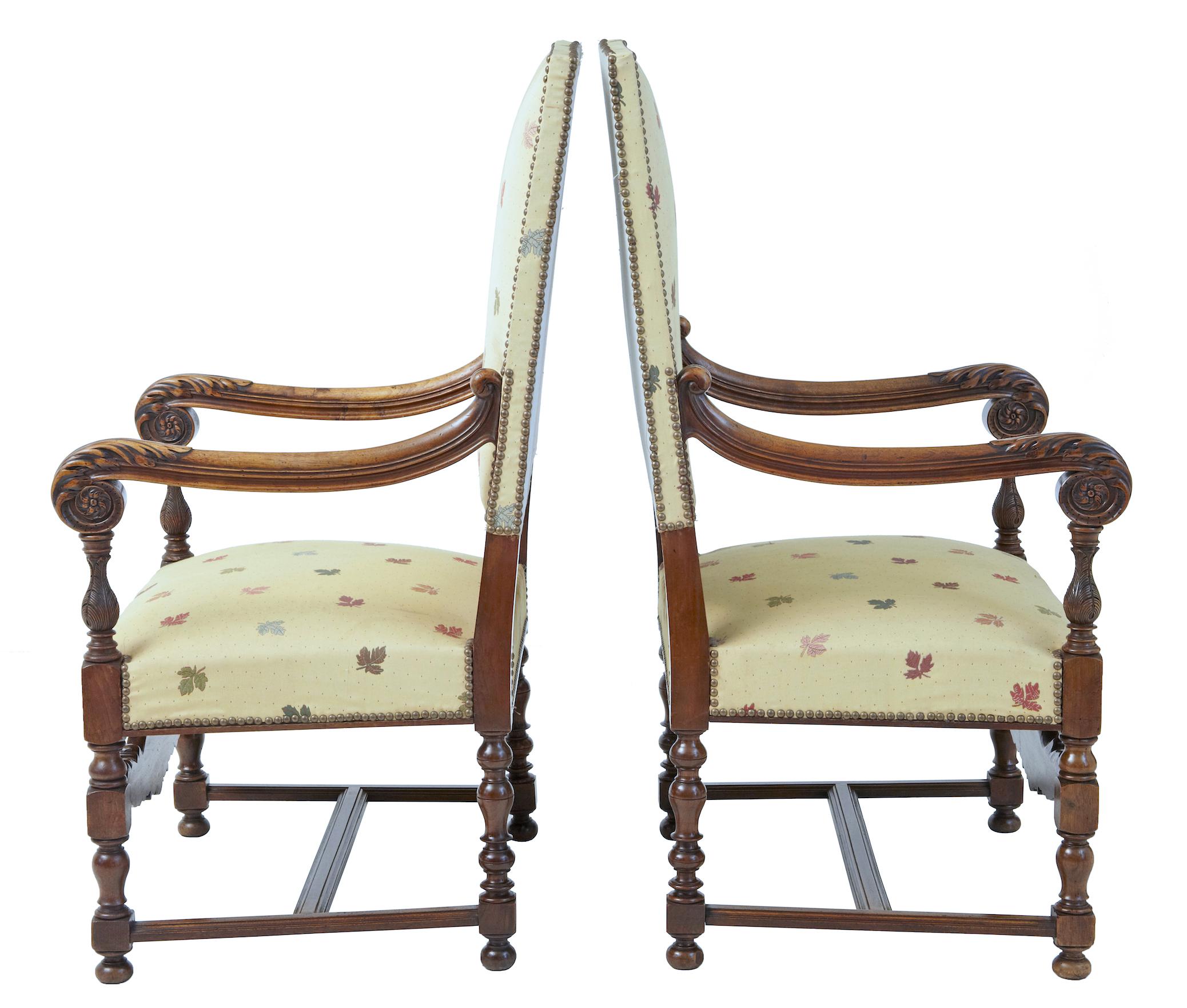 19th century French carved walnut large armchairs, circa 1880.

Elegant pair of 19th century armchairs which are generous in the seat dimensions. Beautifully carved scrolling arms with carved acanthus leaf and roundels. Carved detail in the lower
