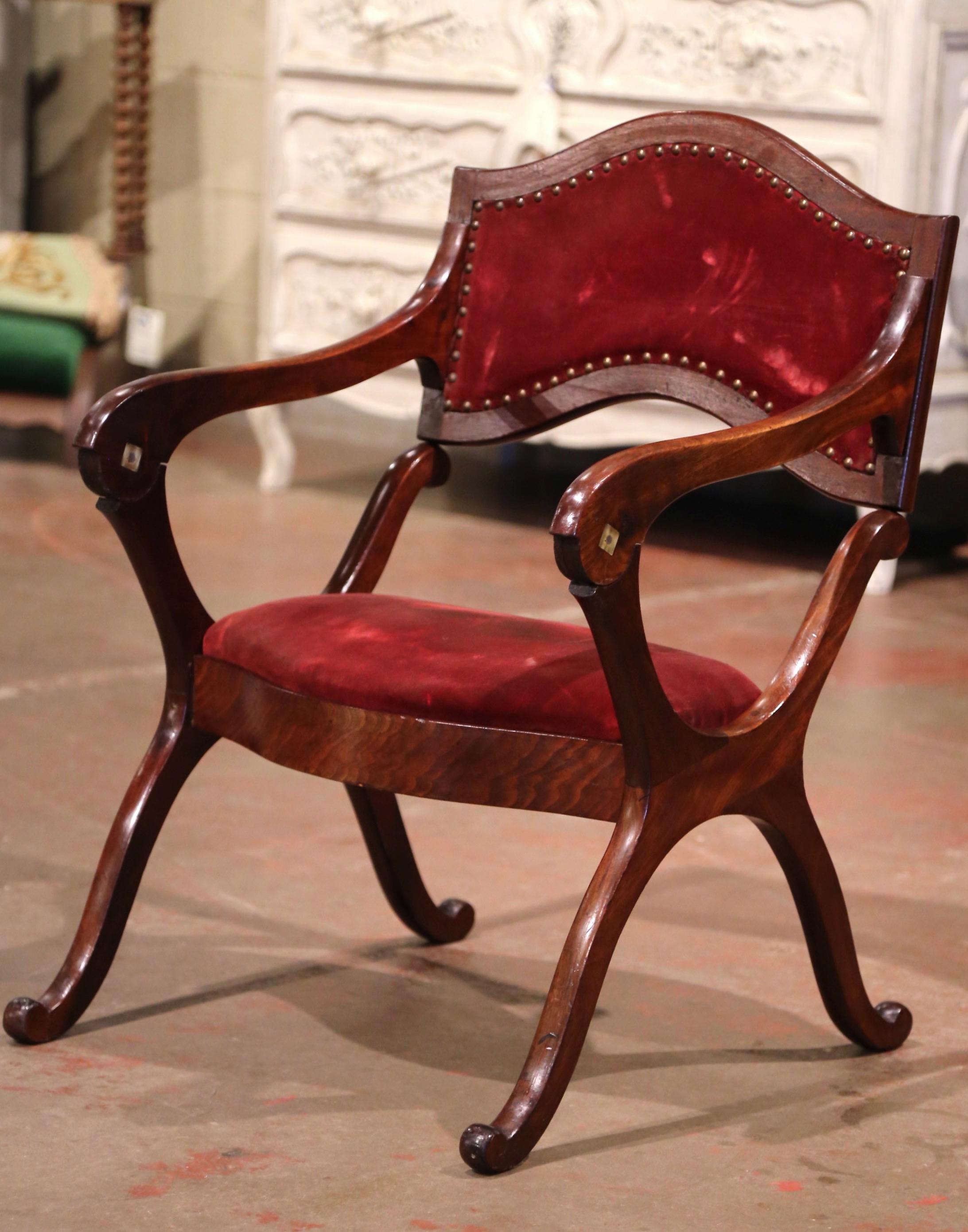 This rare, carved fruitwood “Prie-Dieu” (prayer chair in French), was crafted in France, circa 1880. The unique, antique chair is easily transformed and can open up to a tall prayer bench. The Louis Philippe kneeler stands on four curved legs with