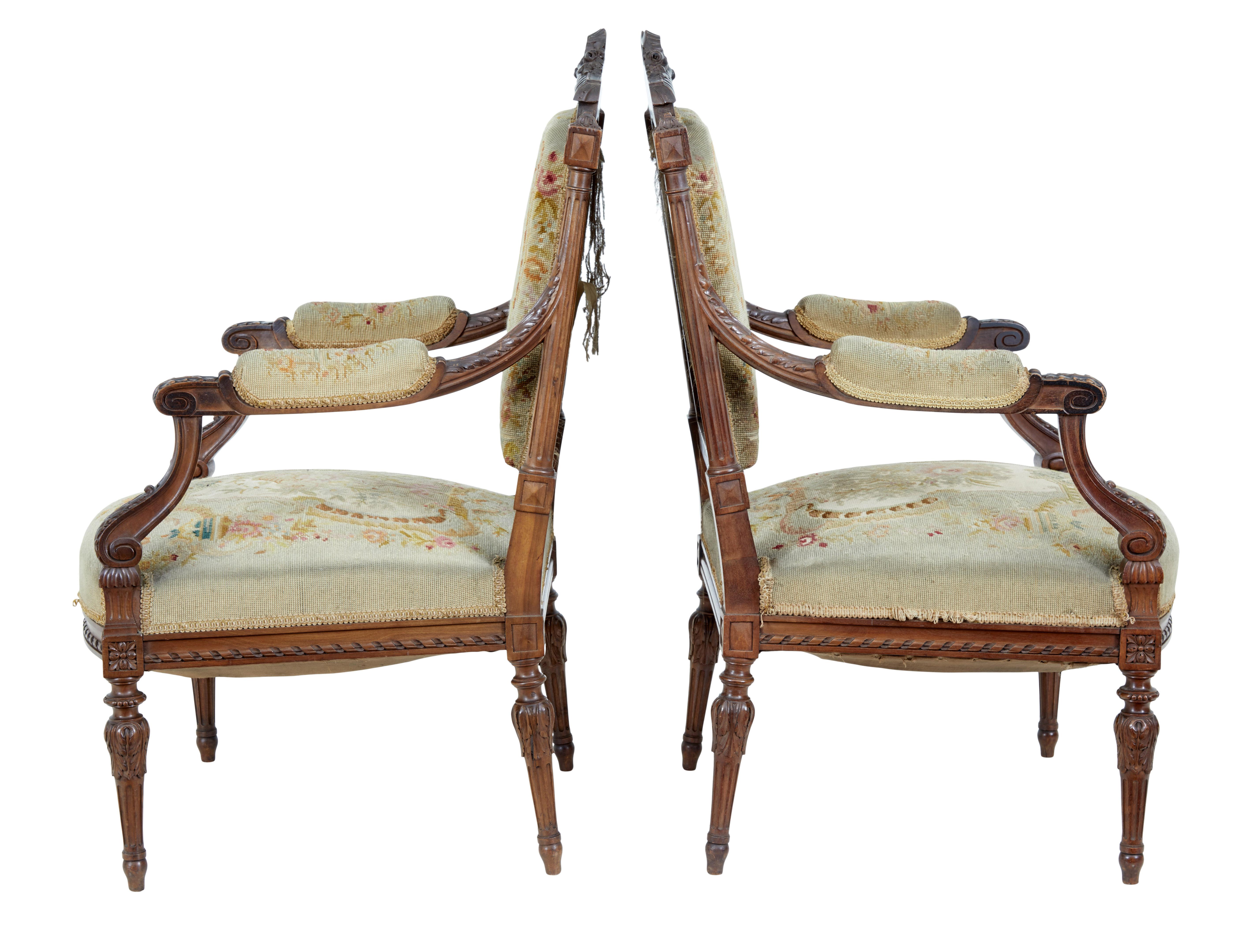 19th century French carved walnut tapestry armchairs circa 1870.

Fine quality pair of french carved armchairs, with fine craftsmanship shown in the quality of the carving.

Heavily carved back rests, carved scrolled arms with acanthus leaf