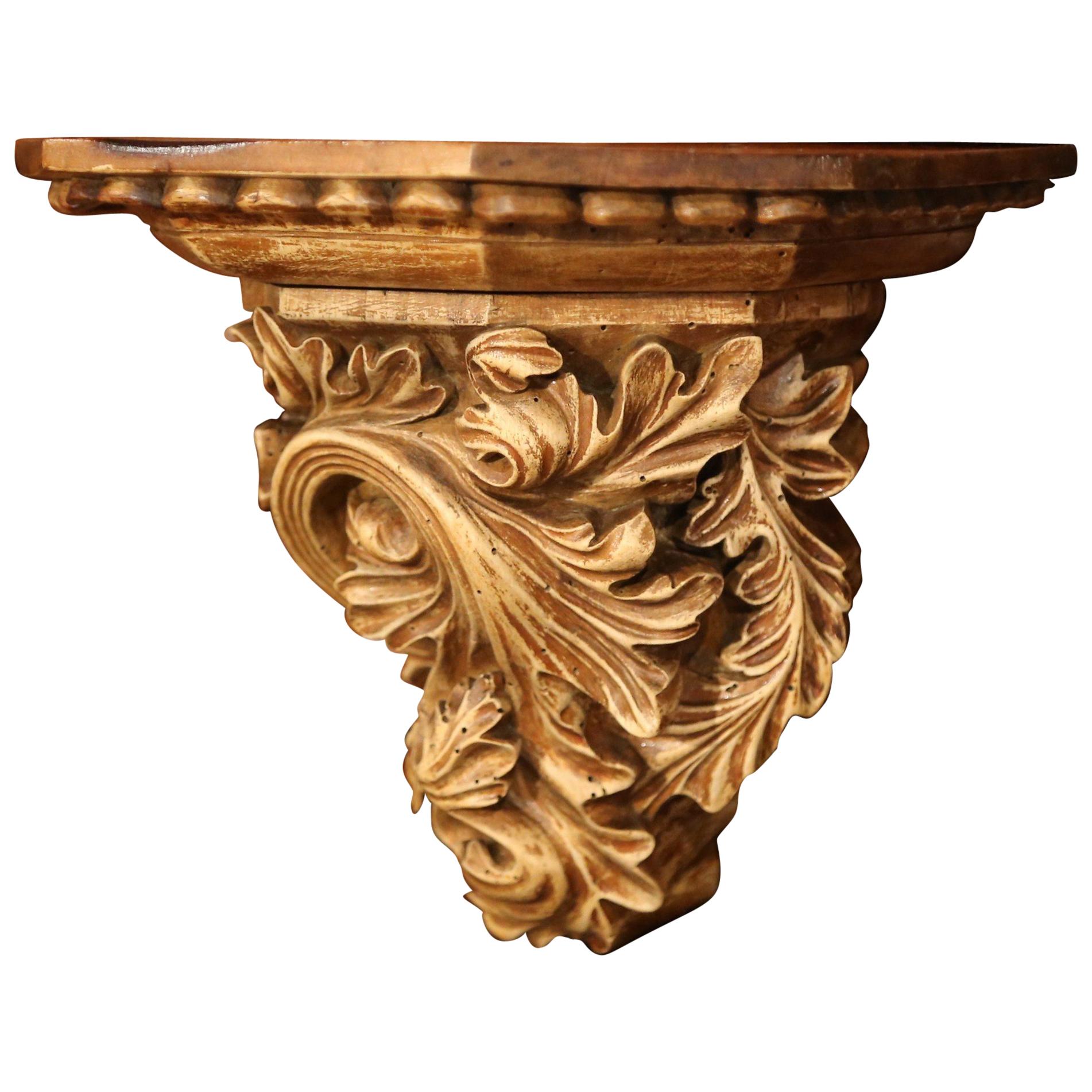 Place a bust or a vase on this elegant antique wall corbel; crafted in France, circa 1860, the fruitwood wall bracket features hand carved leaf motifs with a rich patinated walnut patina. The small console is in good condition, and will accommodate