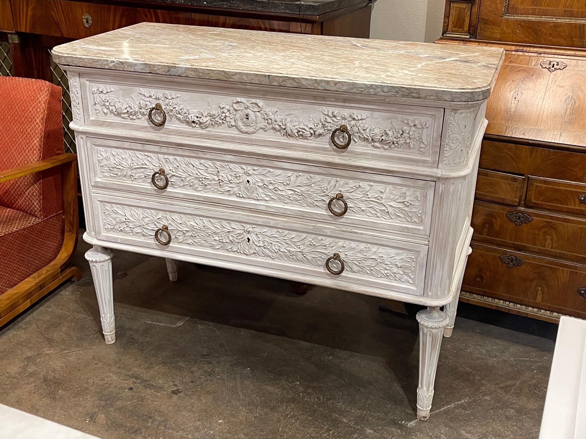 Very fine 19th century carved and white washed walnut commode. Beautiful intricate carvings on this substantial piece and three drawers for storage. Gorgeous!