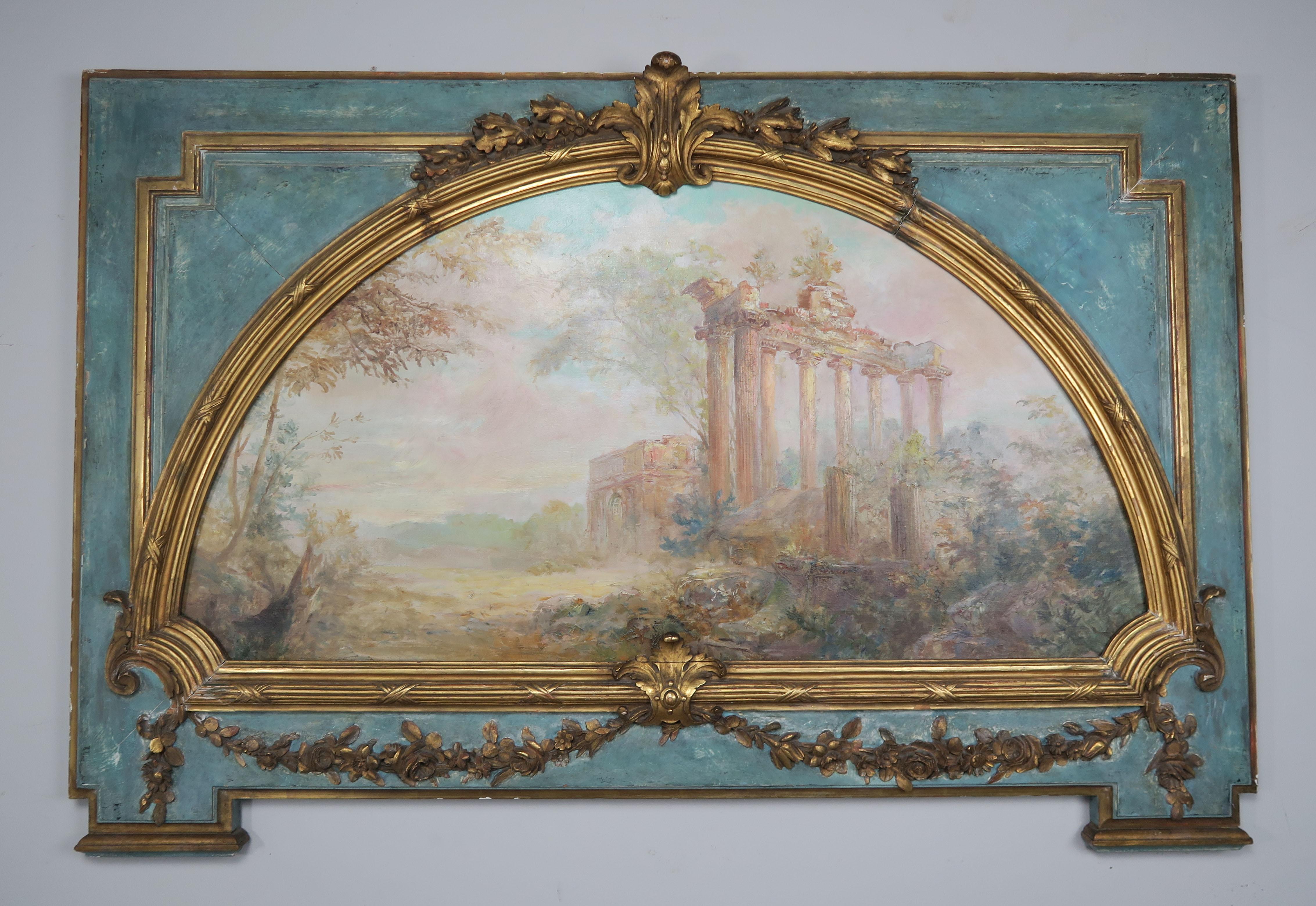 19th century French carved wood panel with an arched cut out inset with a 19th century painted canvas of architectural remnants. The panel is painted in French blue with 22-karat gold leaf highlights on carved portions of panel. Notice the garlands