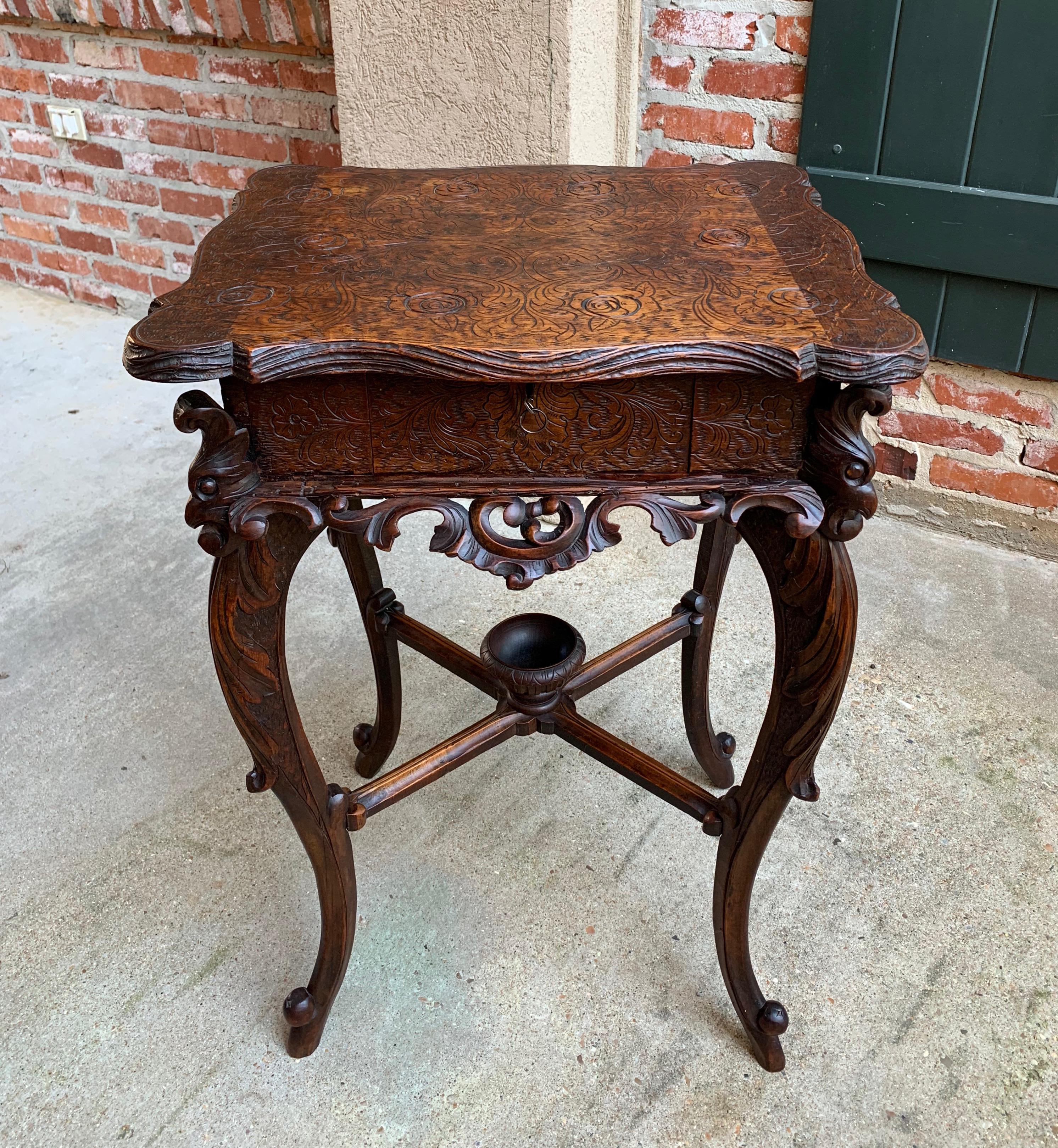 ~Direct from France~
Unique, highly carved antique French table with exquisite details throughout!~
~The overall silhouette is stunning, from the serpentine edge top to the figural side trim, elongated legs and center cross stretcher with decorative