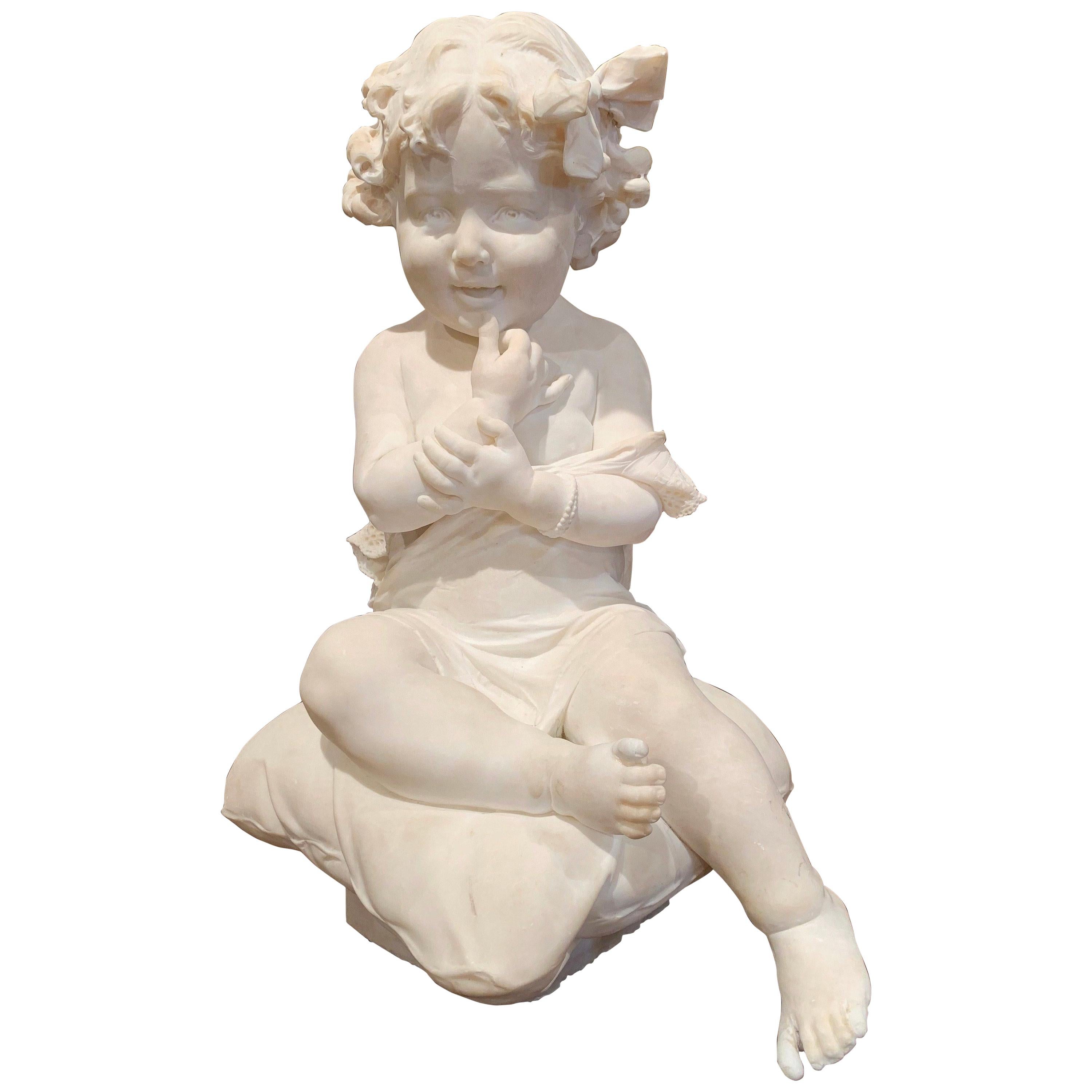 This large antique marble composition was crafted in France, circa 1870. The sculpture features a smiling young girl sited on a cushion and her arms raised and holding her chin. The carved art work shows exquisite detailed craftsmanship from her