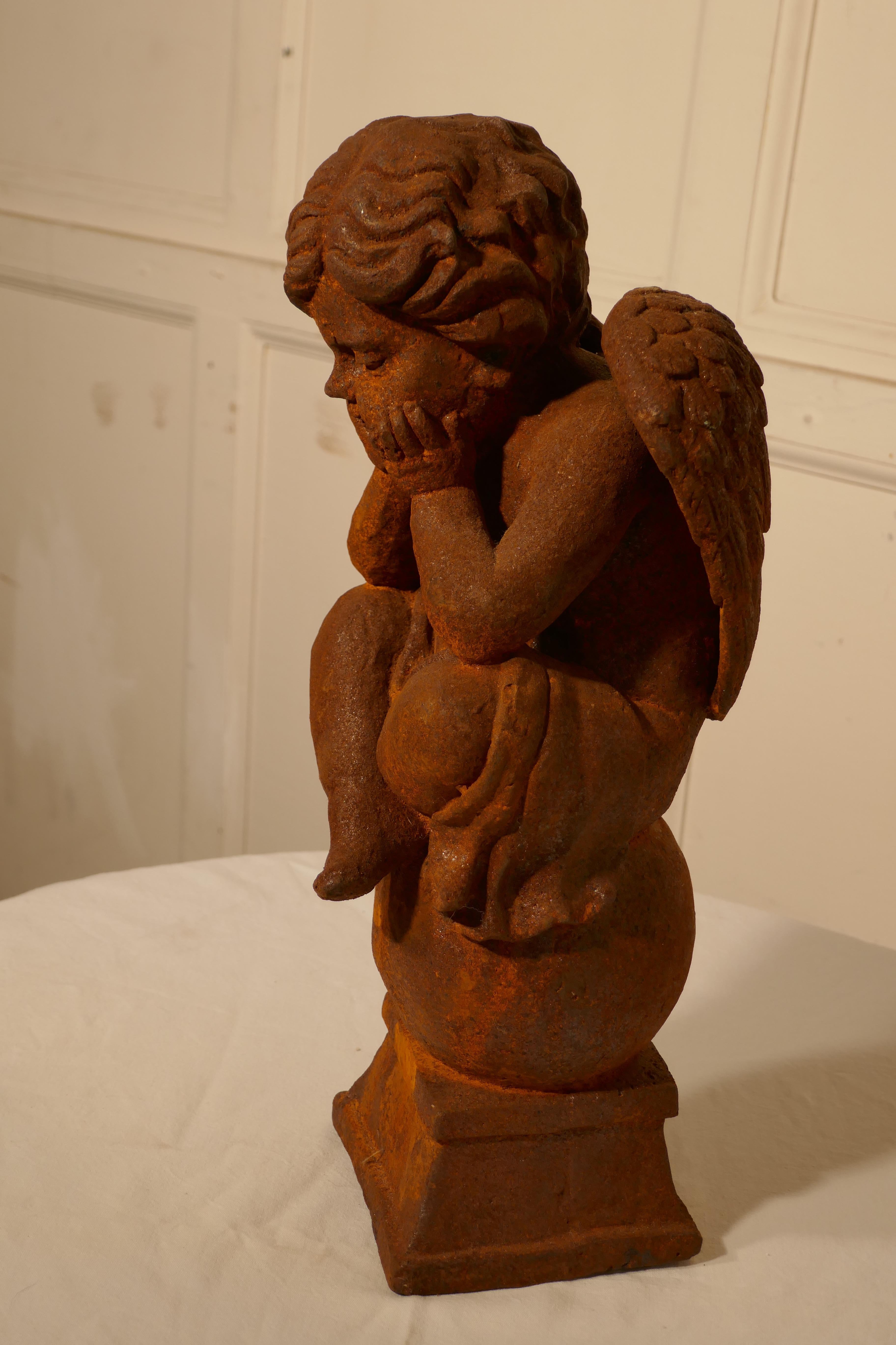 19th century French cast iron angel, putti deep in thought

A charming piece, this little Angel is cast iron, and so very heavy, he sits in a pose of contemplation with his head resting on his hands 
The digure is 16” tall and the base os 5”