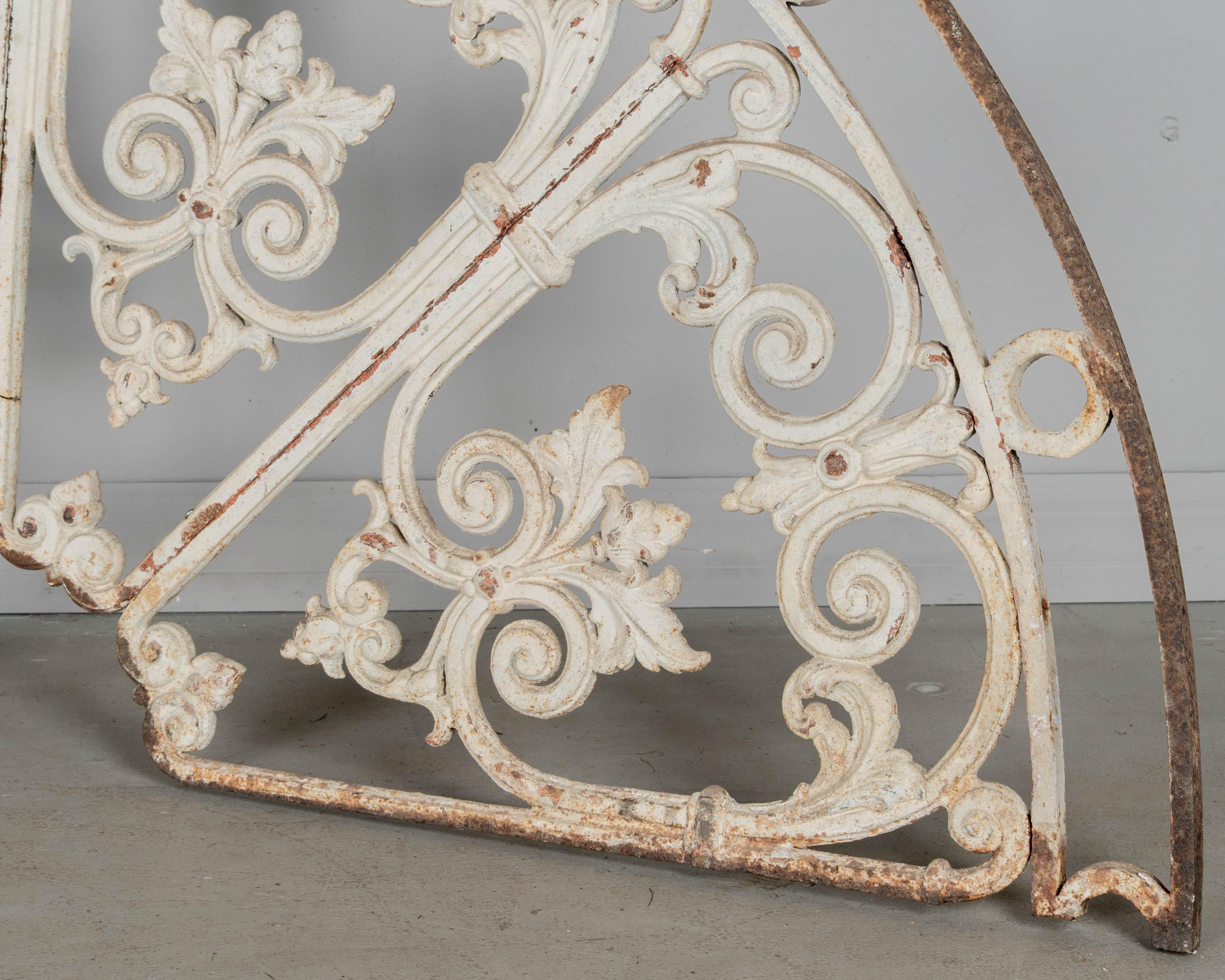 Hand-Crafted 19th Century French Cast Iron Demilune Grille For Sale