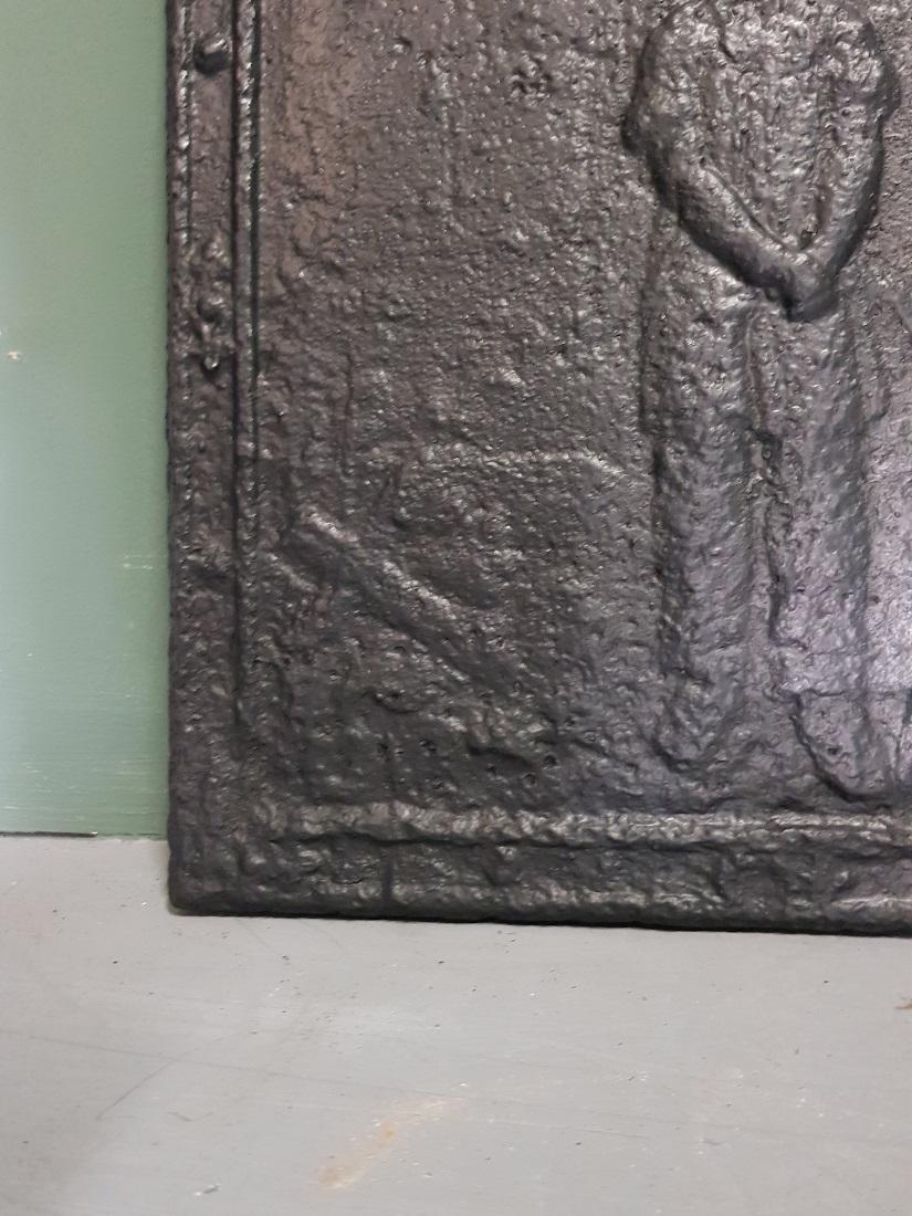 19th Century French Cast Iron Fireback with Image of Farmer with a Napoleon Hat. In Good Condition In Raalte, NL