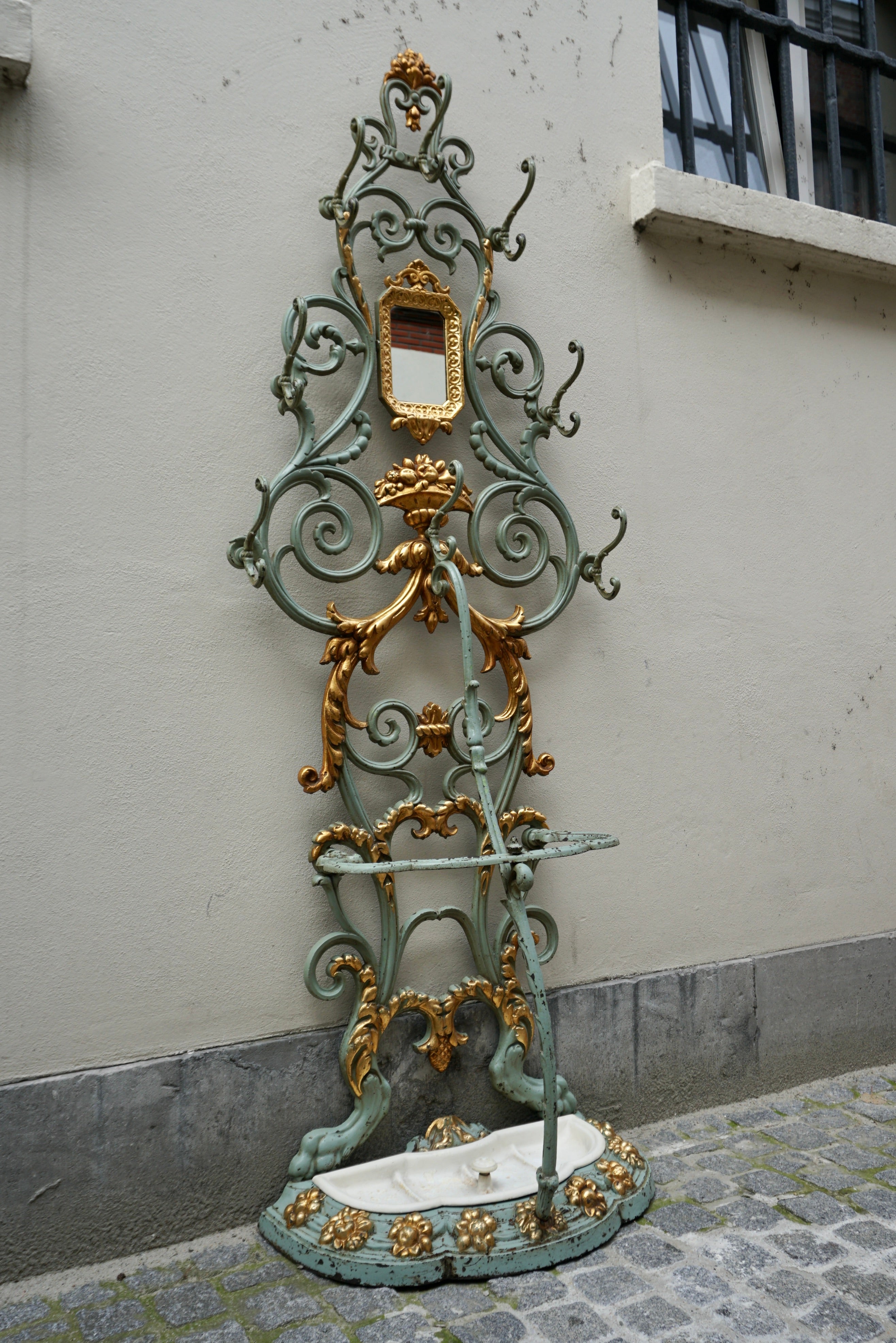 19th Century French Cast Iron Painted and Gilded Hall Stand

Very attractive 19th Century French cast iron painted and gilded hall stand with original small mirror. Sourced from France and in good original condition.Place this elegant antique hall
