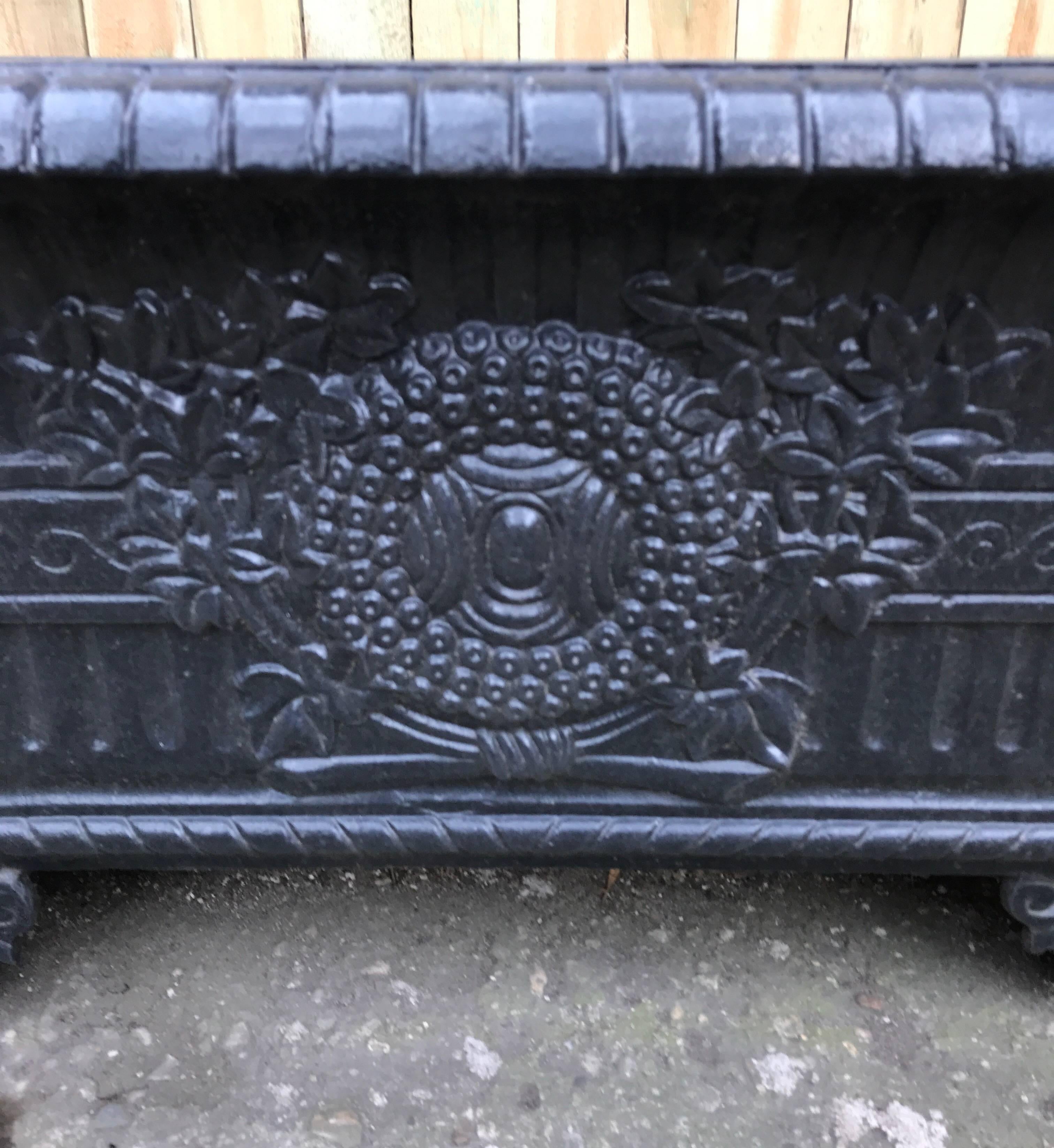 A 19th century French cast iron rectangular planter or jardinière with classical high relief decoration.
Supported on splayed Acanthus leaf decorative bracketed feet on each corner. Wonderful decorative
garden element.
