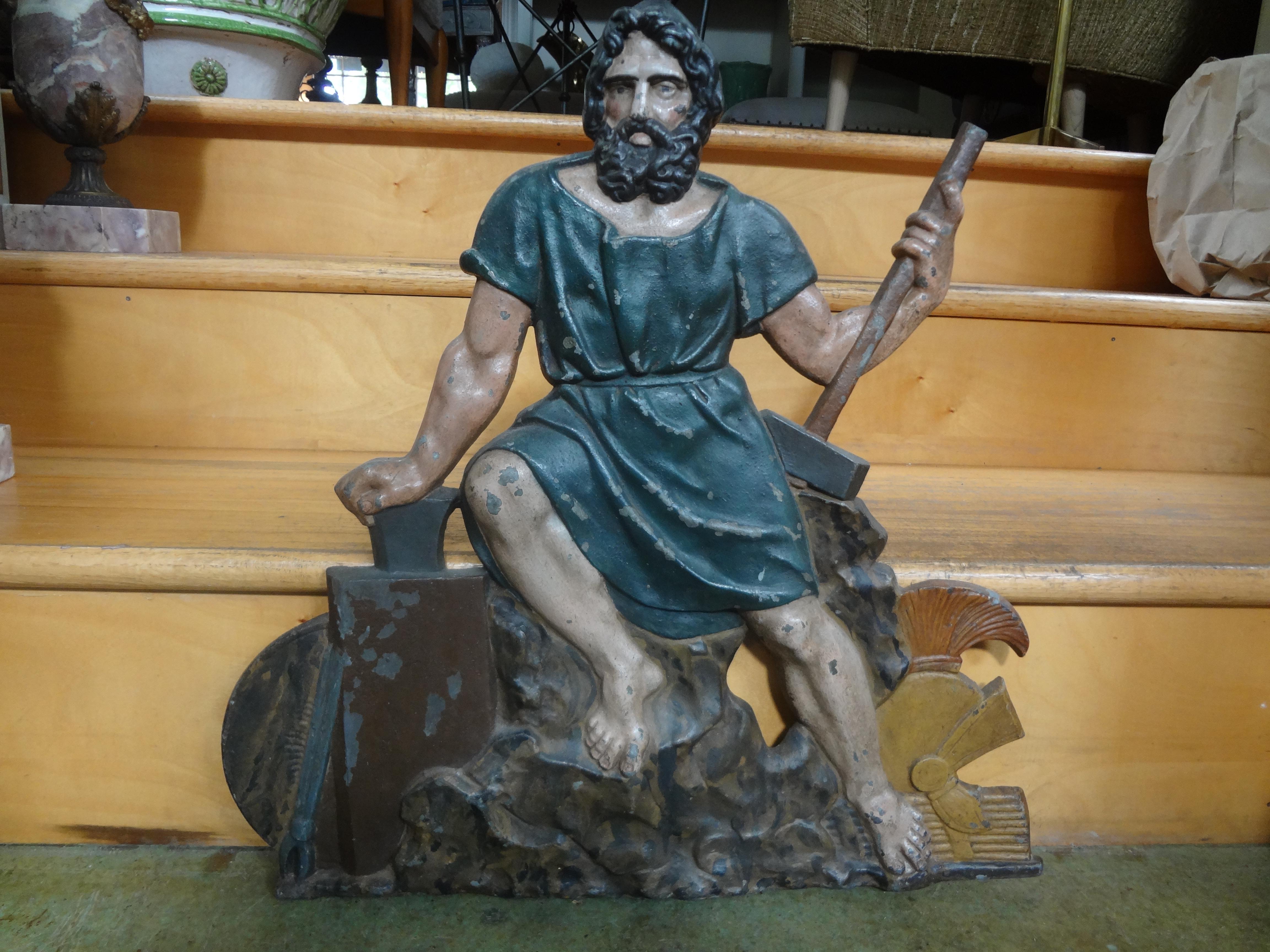 19th century French cast iron trade sign. This French polychrome iron trade sign depicts a strong handsome male figure and most likely was from a French iron foundry. This great antique French trade sign makes a perfect wall-mounted sculpture.