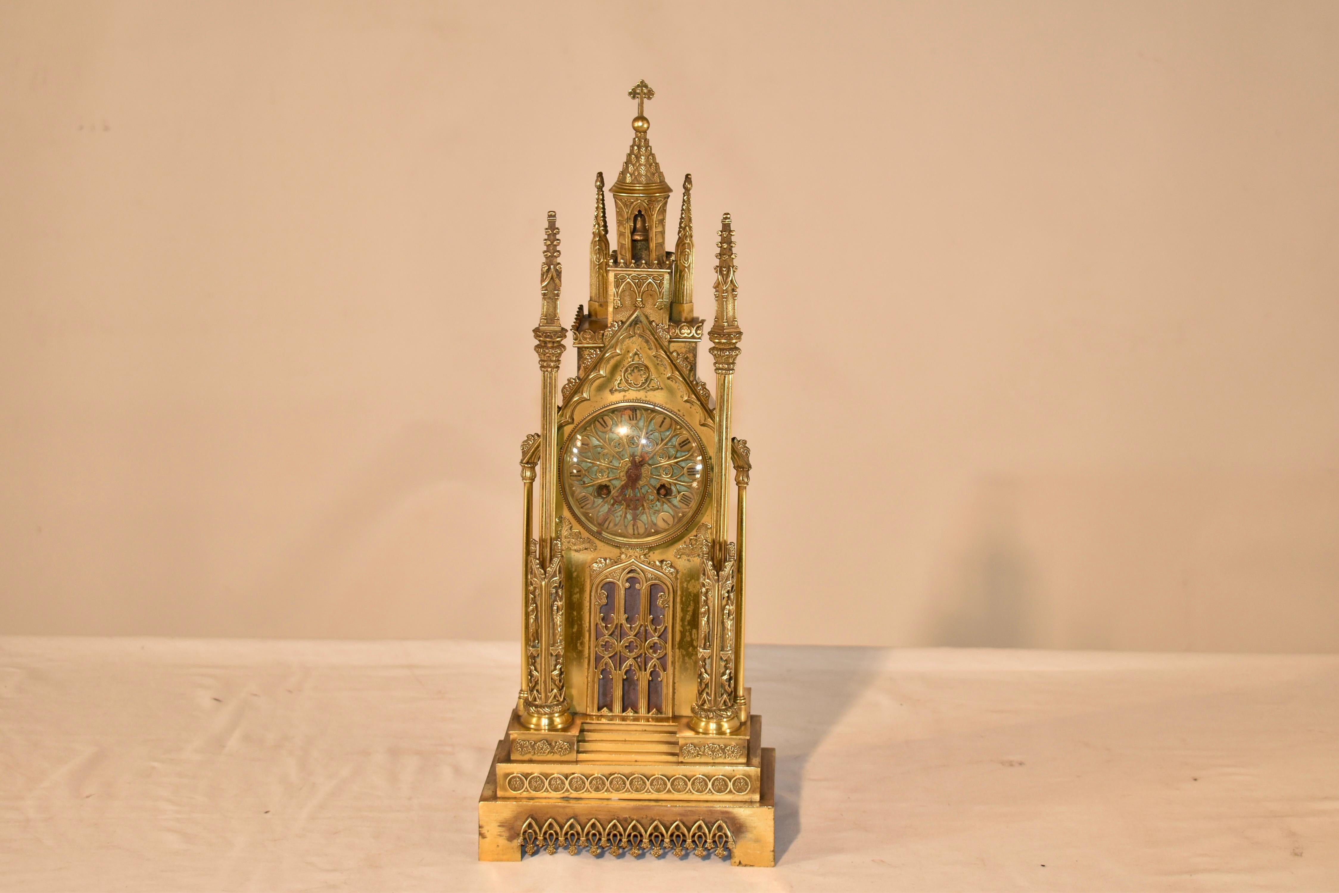 19th century beautifully hand crafter cathedral clock in gilt bronze.  This is a magnificent example of 19th century French craftsmanship.  There are many beautiful details to this piece, from the bell in the tower at the very top, down to the