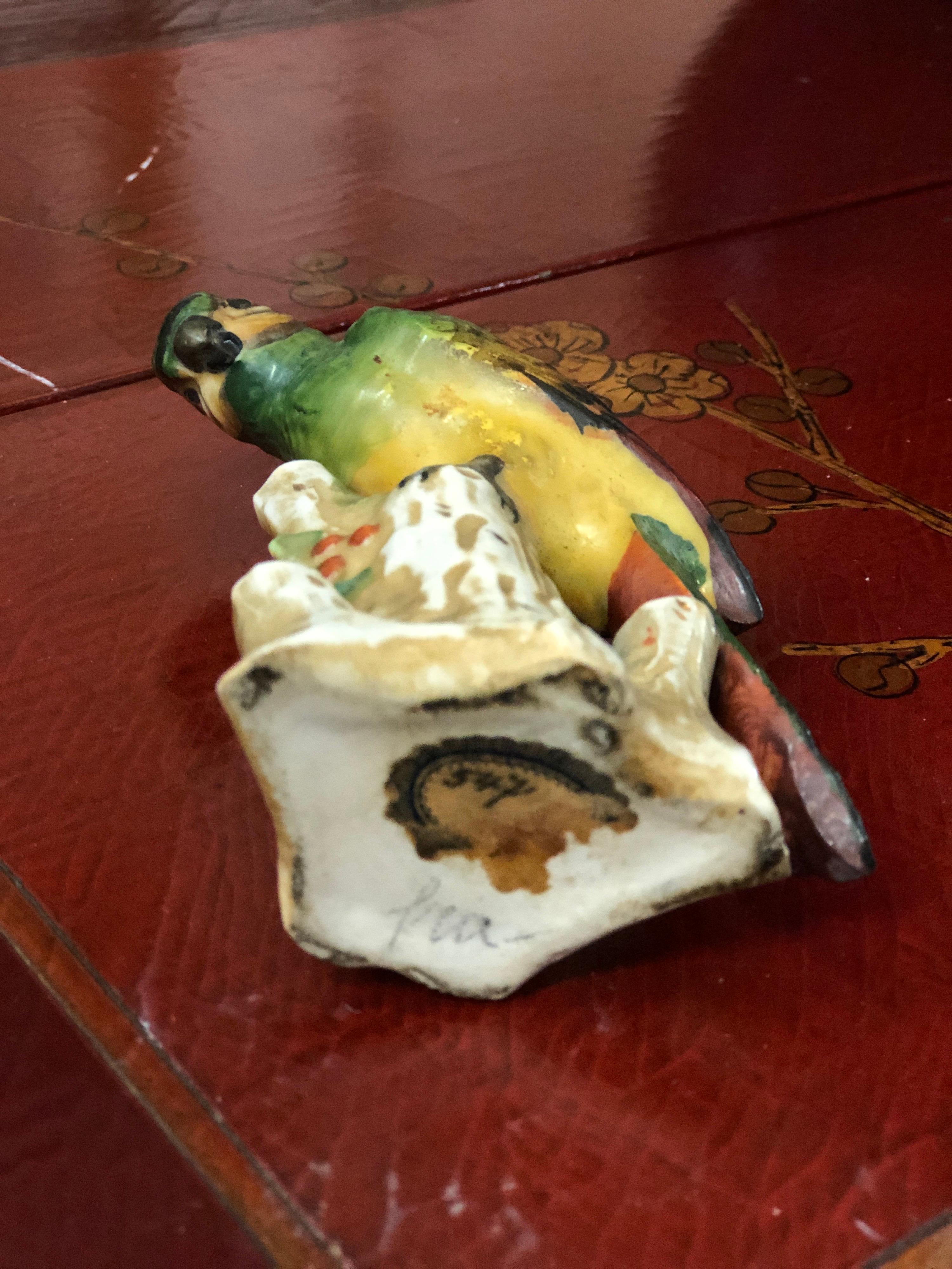 Small bird in lovely vivid colors made of ceramic with mark on the bottom.
France, circa 1890.
