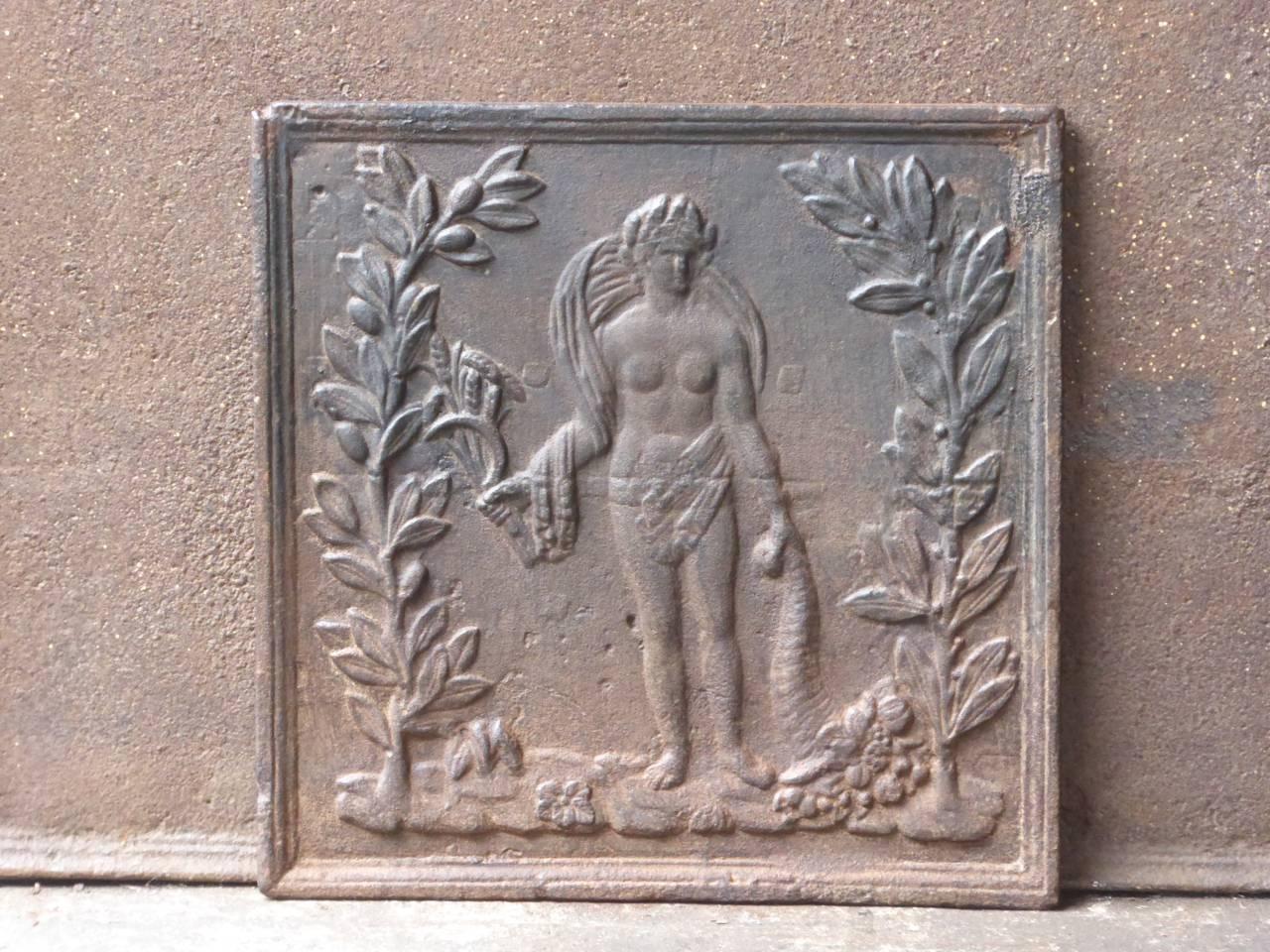 19th century French fireback with the goddess Ceres. Goddess of agriculture (particularly grain) and the maternal love.

We have a unique and specialized collection of antique and used fireplace accessories consisting of more than 1000 listings at