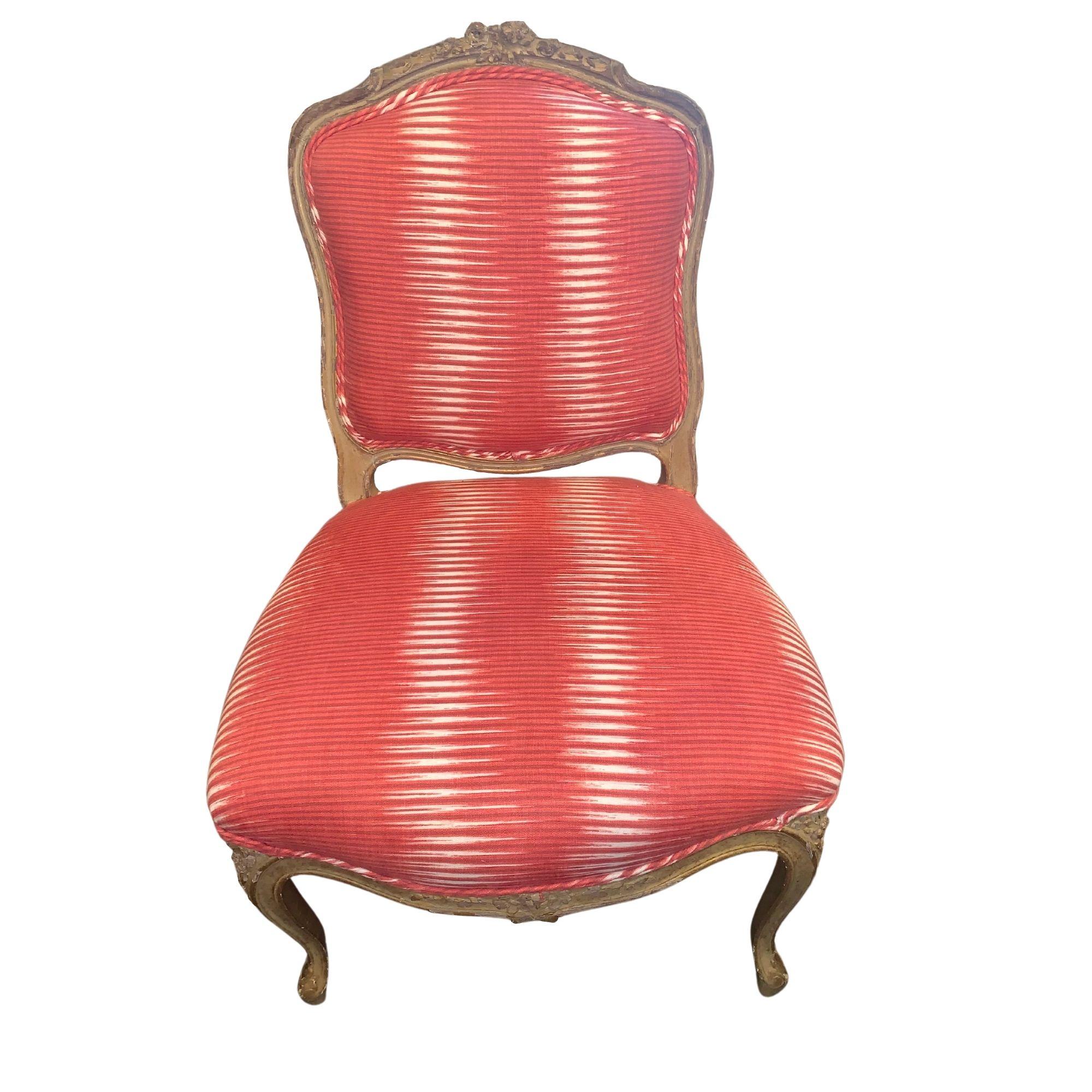 19th century French chair recovered in Michelle Nussbaumer's, Cosmico Ikat in Carmine, fabric from her line with Clarence House.