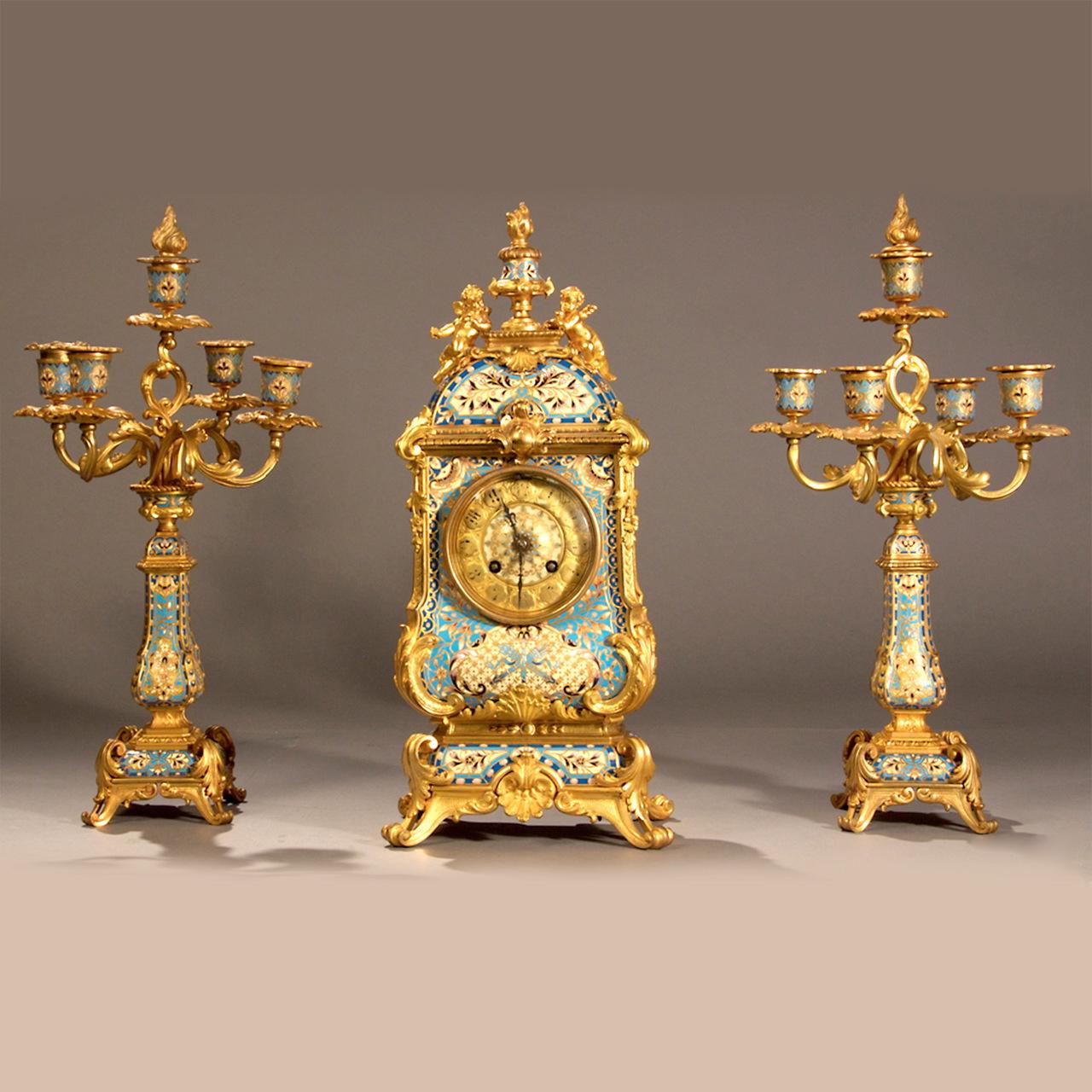 Fine quality and attractive French champleve gilt bronze and light blue champleve enamel clock set. Retailed by Camerden & Forster, New York. Gilt bronze and champleve enamel. 

Origin: France 
Date: circa 1890
Dimension: Clock: 17 in. x 17 1/2