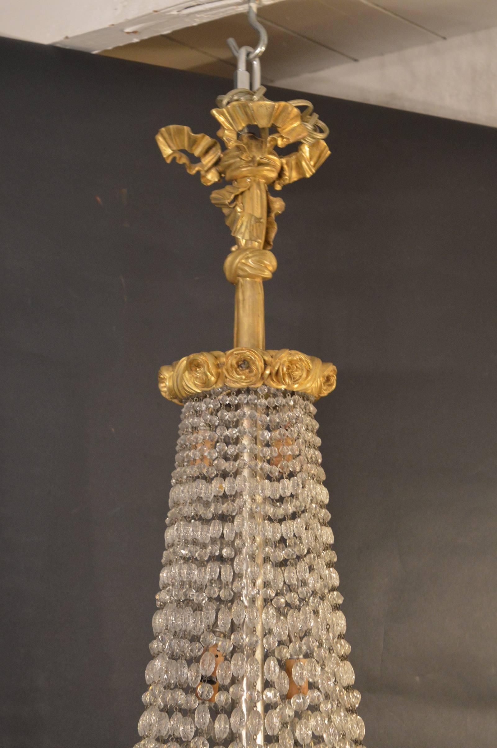 19th century French chandelier, ormolu gold plated bronze with crystals.