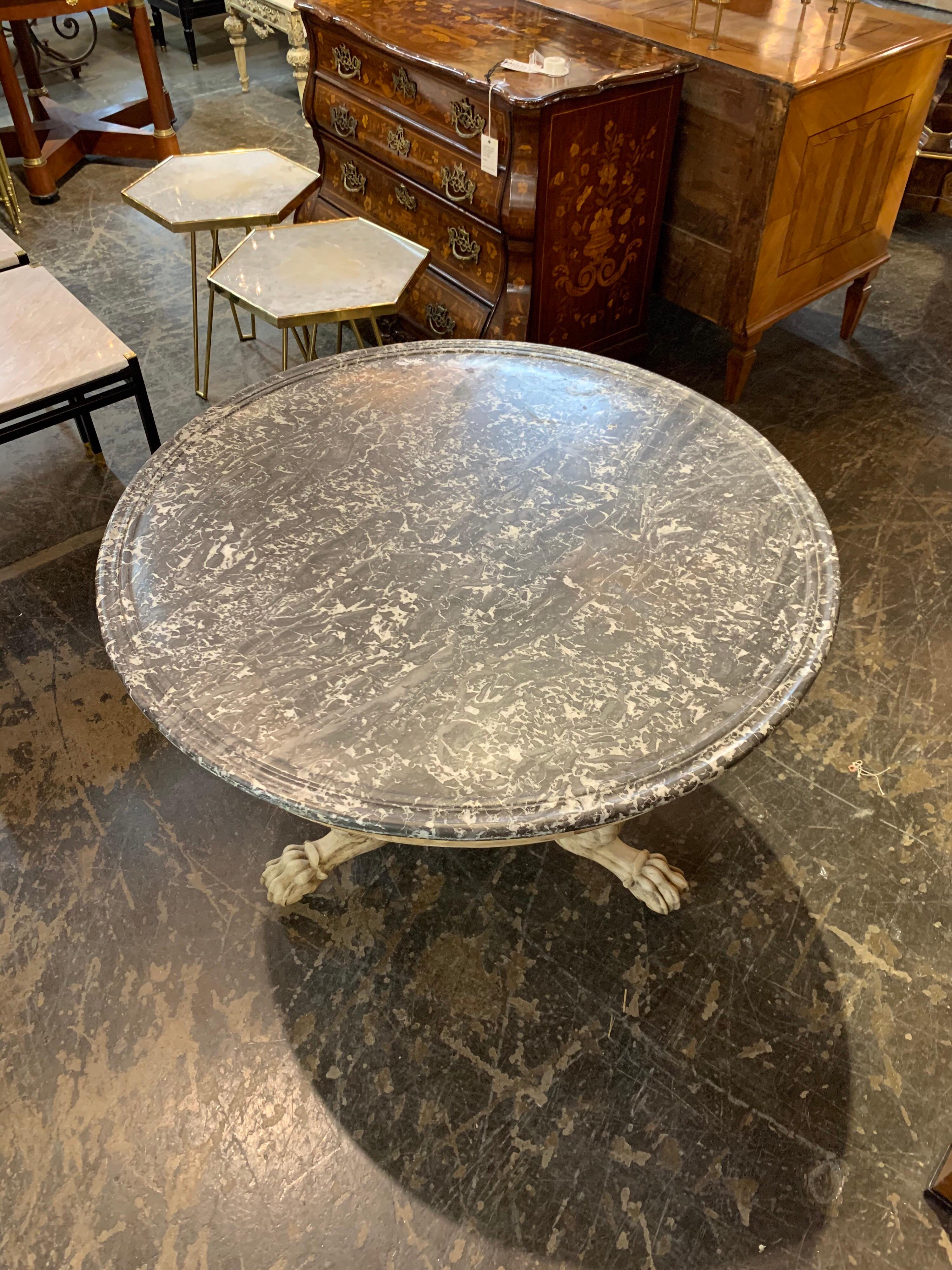 Amazing 19th century French Charles X table with a gorgeous marble top. The base is beautifully carved and has a fine bleached patina. This stunning piece would definitely create a beautiful focal point.