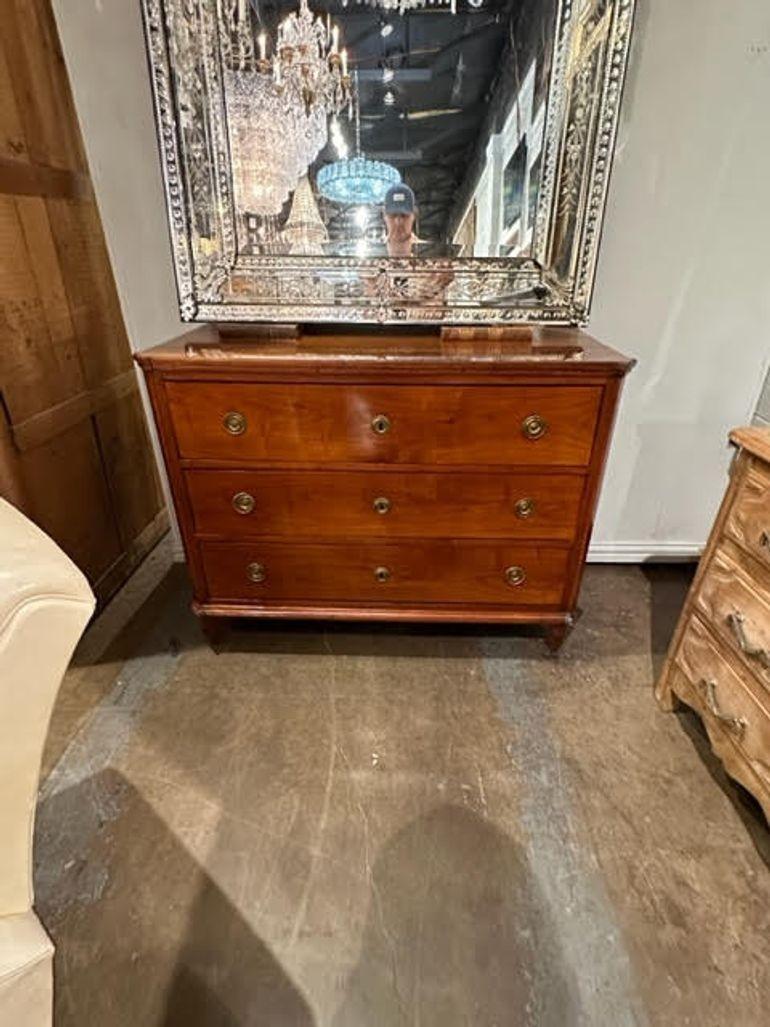 Handsome 19th century French Charles X mahogany commode. Featuring clean lines and an exceptional polished finish. A true classic! Gorgeous!
