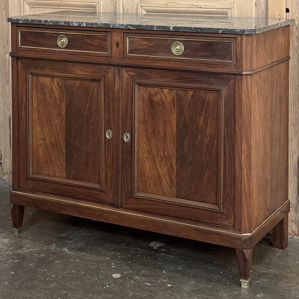 19th Century French Charles X Mahogany Marble Top Buffet represents a period in French history where a staid, tailored look was popular with the court, and remains so a century and a half later due to the style's ability to work with most any type