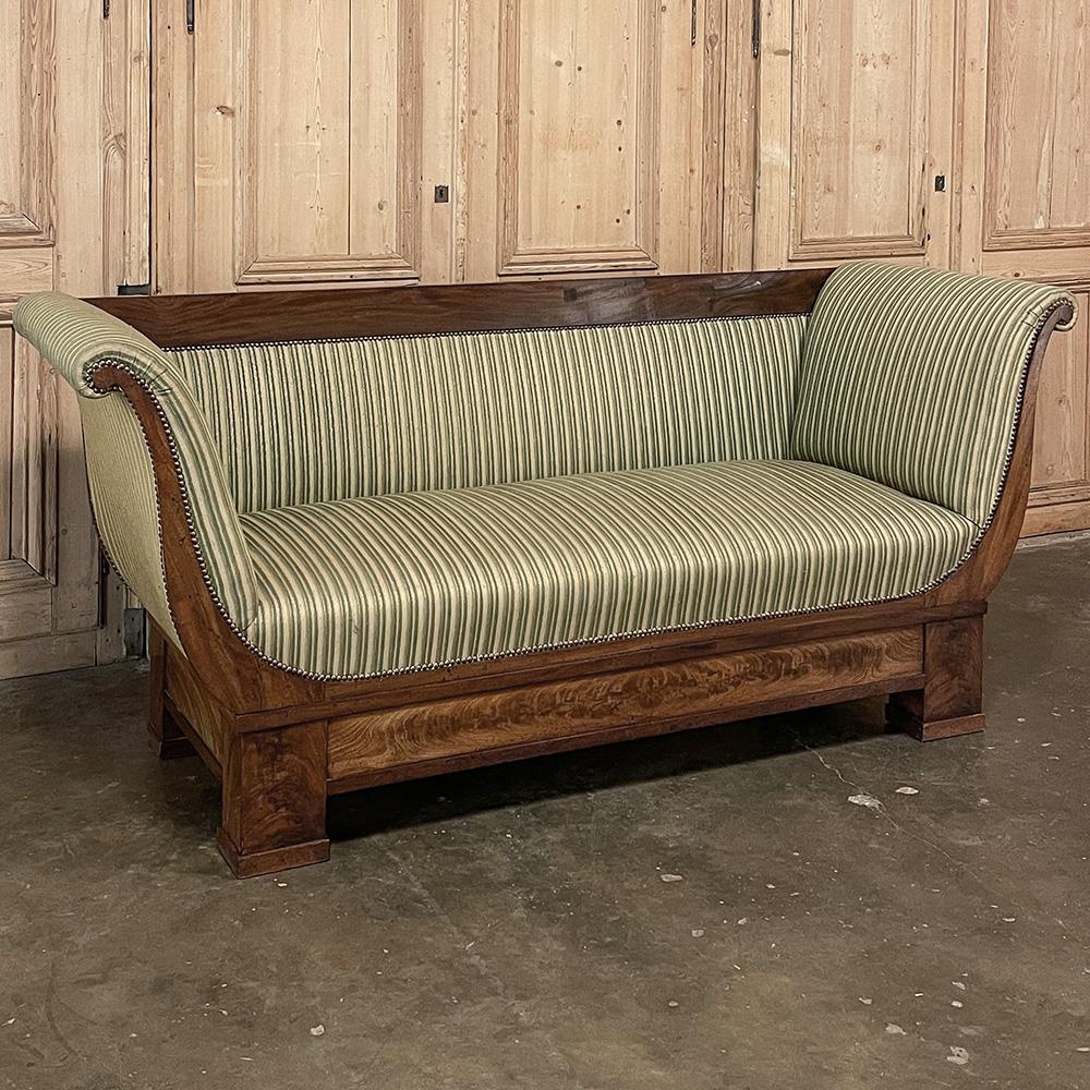 19th century French Charles X Mahogany sofa is the sublime expression of understated elegance! The style was born during a period of austerity when the court wished to downplay the excesses of the monarchy to appease the public, although such