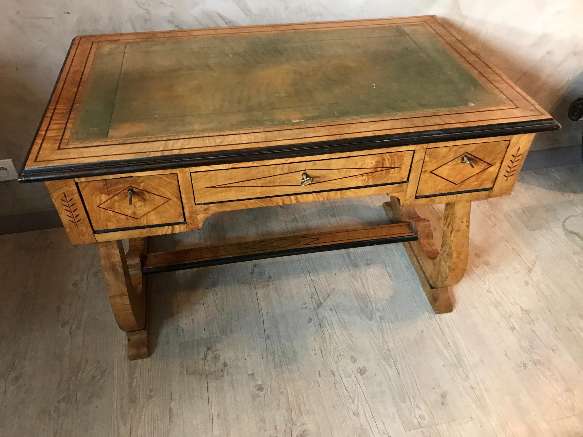 Beautiful and rare French desk made with Sycamore veneer, Charles X style. The top of the desk is made with a green leather that shows fading with use.
Three large and depth drawers with a dovetail drawer construction, with their original