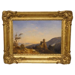 Cuadro al óleo sobre lienzo del siglo XIX que representa un paisaje con un castillo francés, con marco de madera dorada