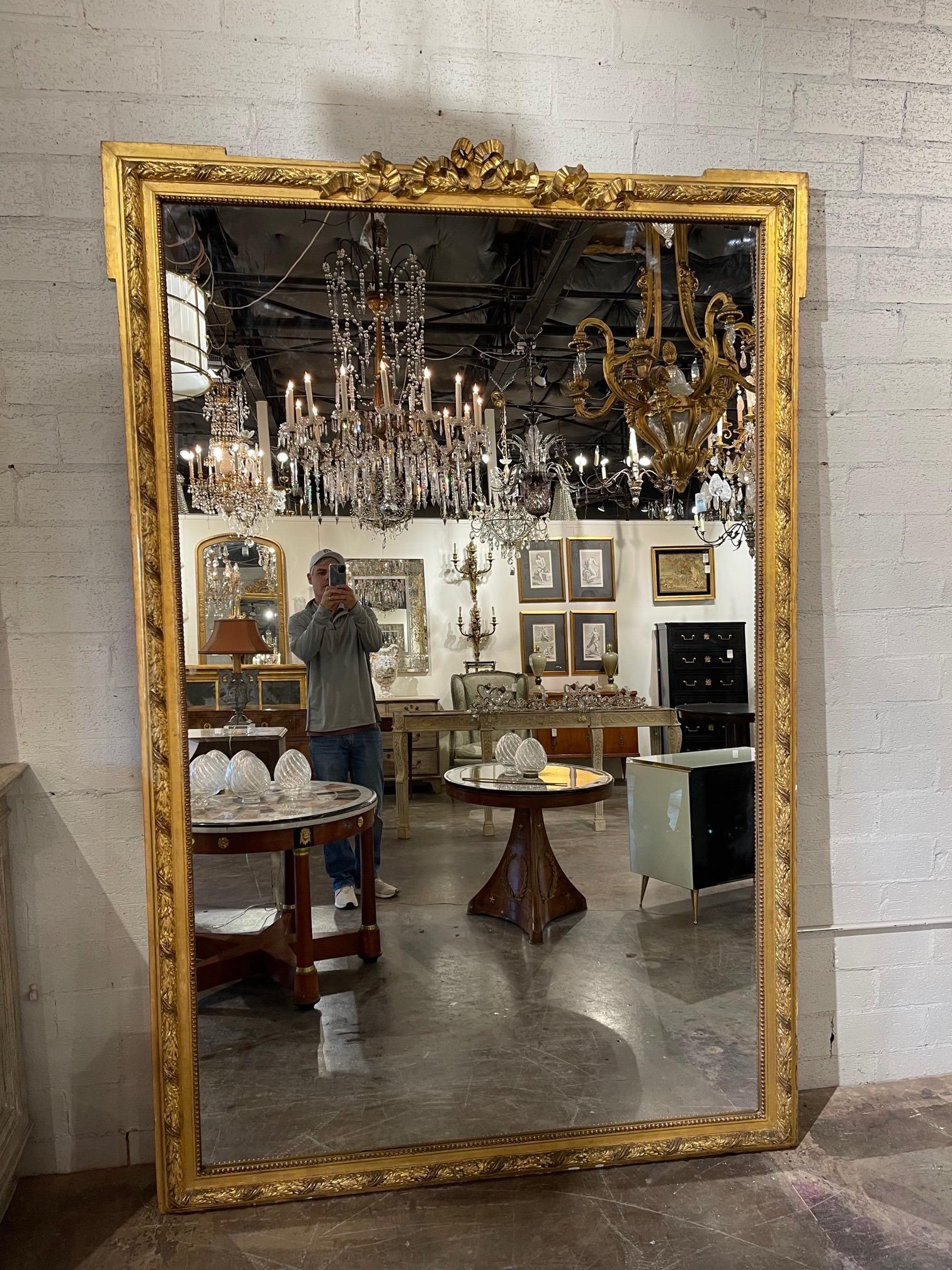 Superb 19th century large scale French Chateau size Louis XVI style mirror.   Very fine carvings and gilt on these. Creates a huge impact!! 