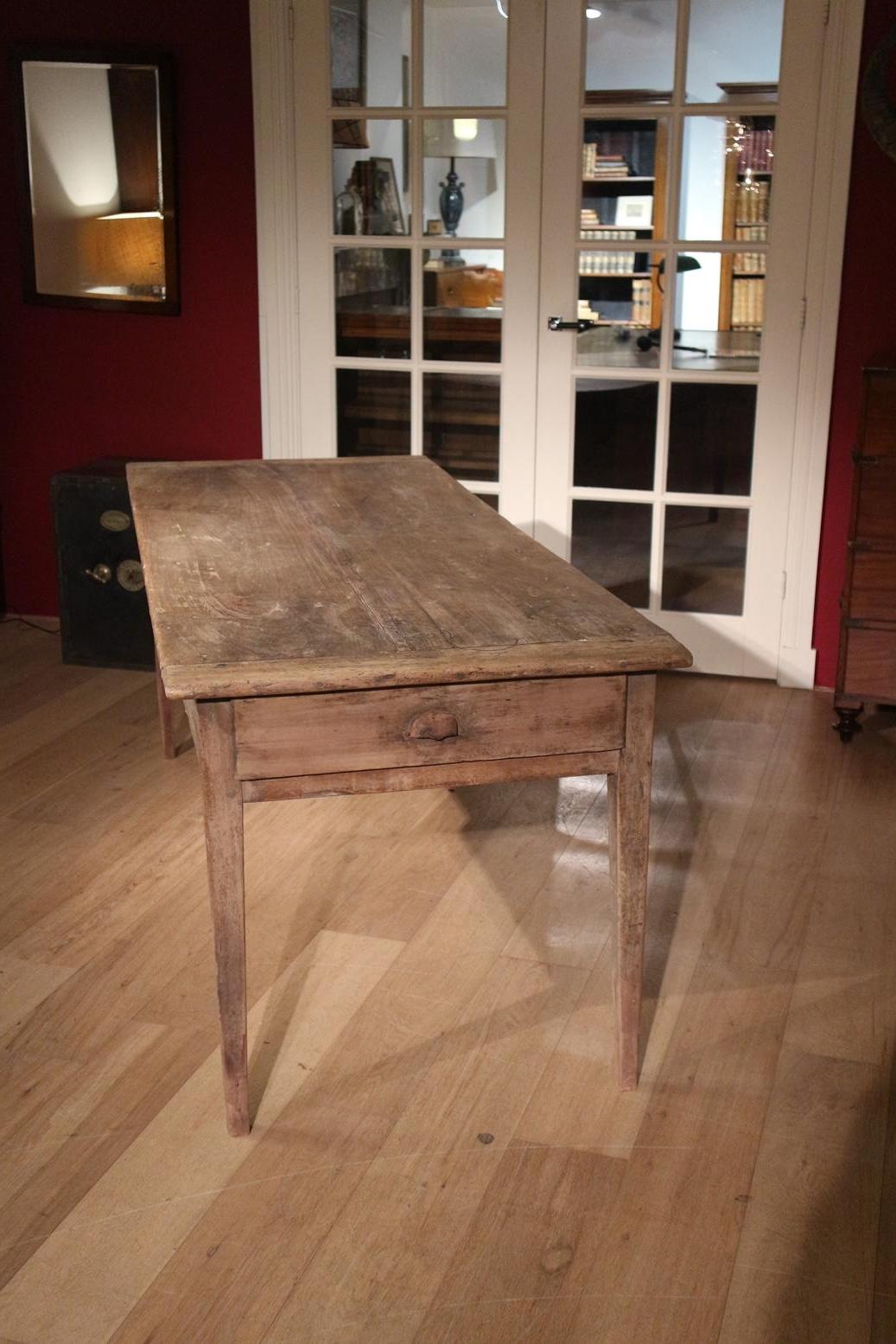 Antique French cherry wood dining room table in completely original condition. Table has 2 drawers. The table is in very good condition. All joints have been glued again, but the outside has been left untouched

Origin: France

Period: 19th