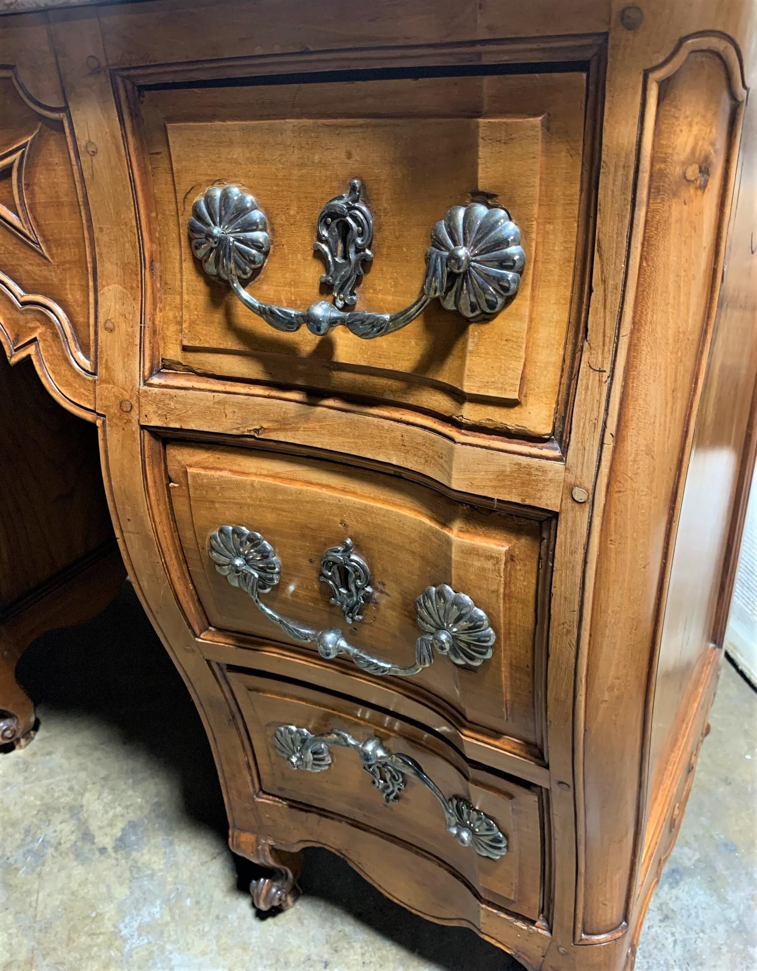 Outstanding 19th century French cherrywood and marble top serpentine fronted bathroom vanity of bombe form. The linen and silk lined drawers feature fancy polished steel pulls and escutcheons. The basin and faucets are possibly by Sherle Wagner. The