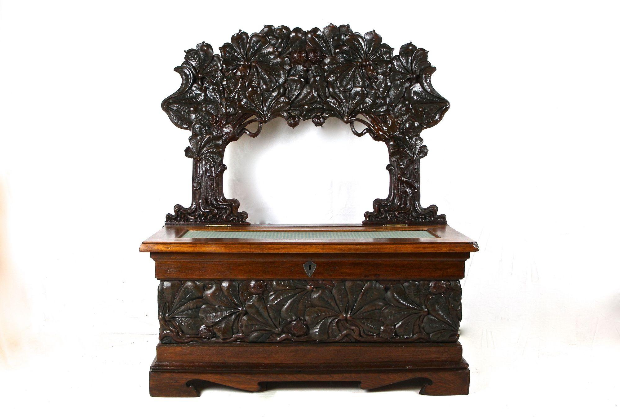 One of a kind late 19th/ early 20th century chest bench from the early Art Nouveau period around 1890/ 1900 in France. This artfully crafted, exceptional looking Art Nouveau chest bench impresses with its elaborate handcarved backrest which shows an