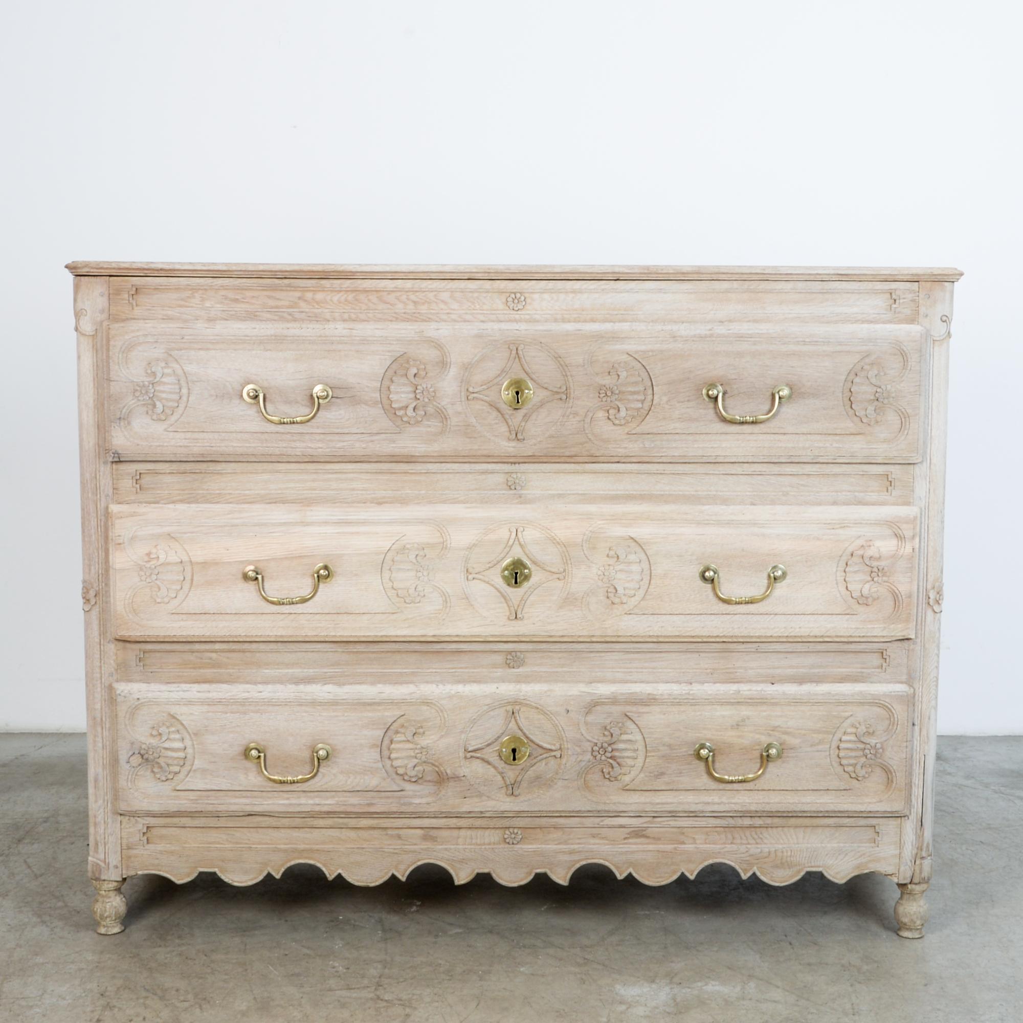 From circa 1820 France, with 3 locking drawers, a sturdy drawer cabinet in oak. Finished with a clear wax and oil blend, this chest of drawers is clean and prepared for your interior. Featuring intriguing period details, characteristic shape and