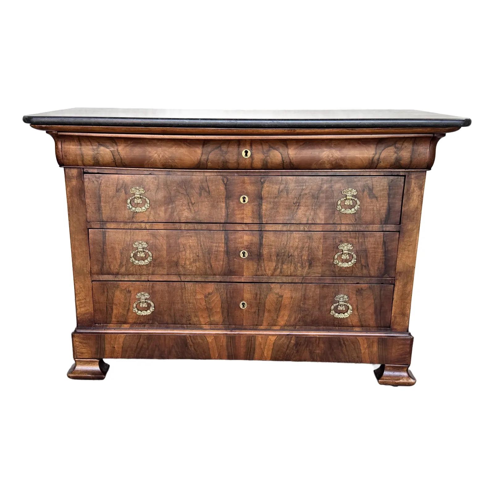 This 19th century Louis Philippe chest is stunning. The French do such an amazing job with veneer and the front of this chest is no exception . Brilliant black Marble and amazing original pulls from that period. This item is it perfect condition