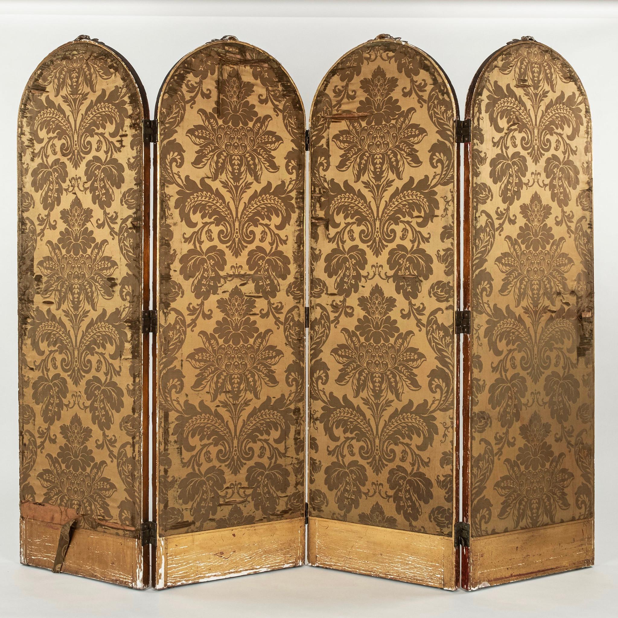 A lovely 19th Century French giltwood folding screen painted in the Chinoiserie style and backed in silk.