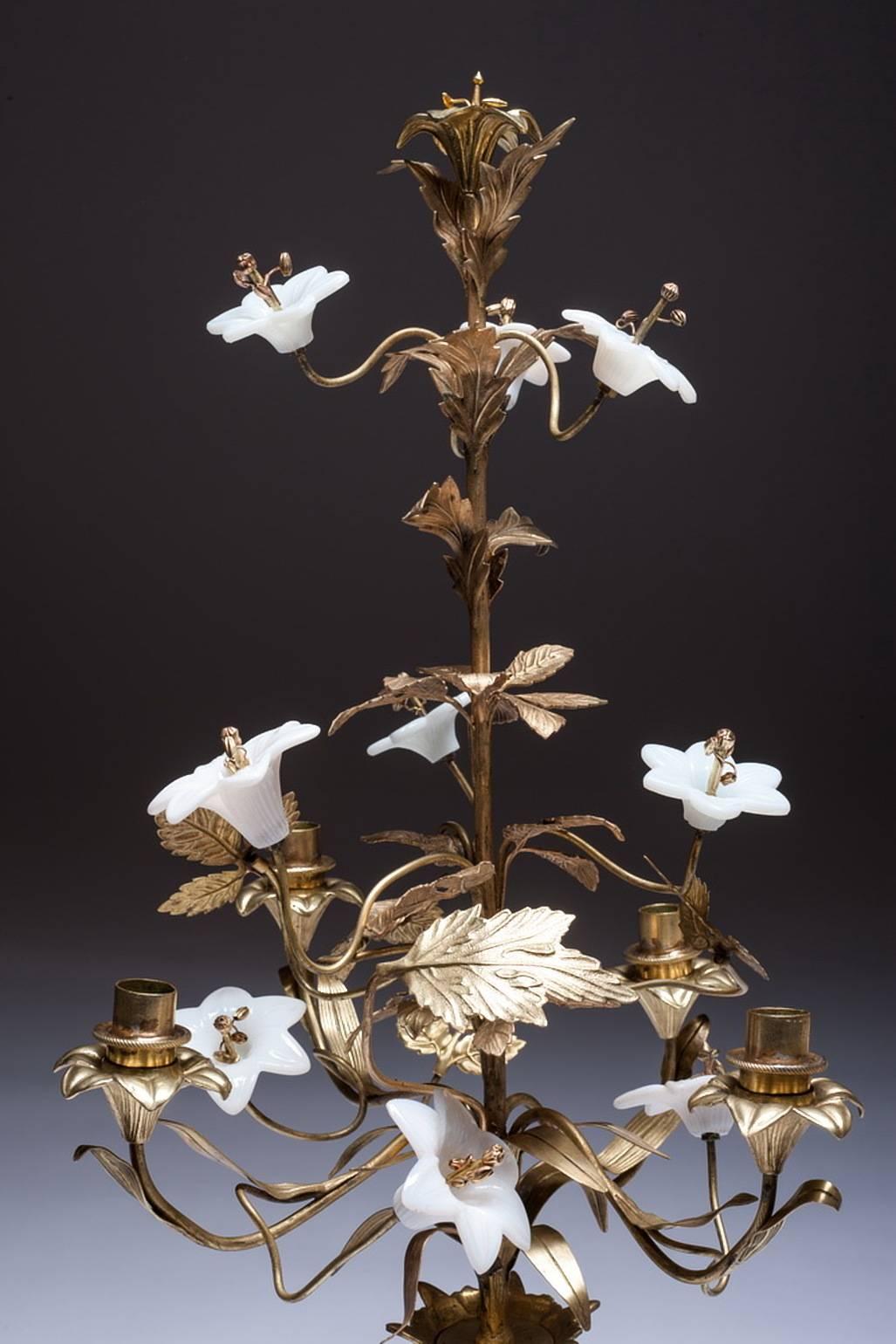 This is a magnificent example of an early 19th century French church candelabra in stunning original gilt. With beautiful porcelain flowers in perfect original condition and room for four candles.

 