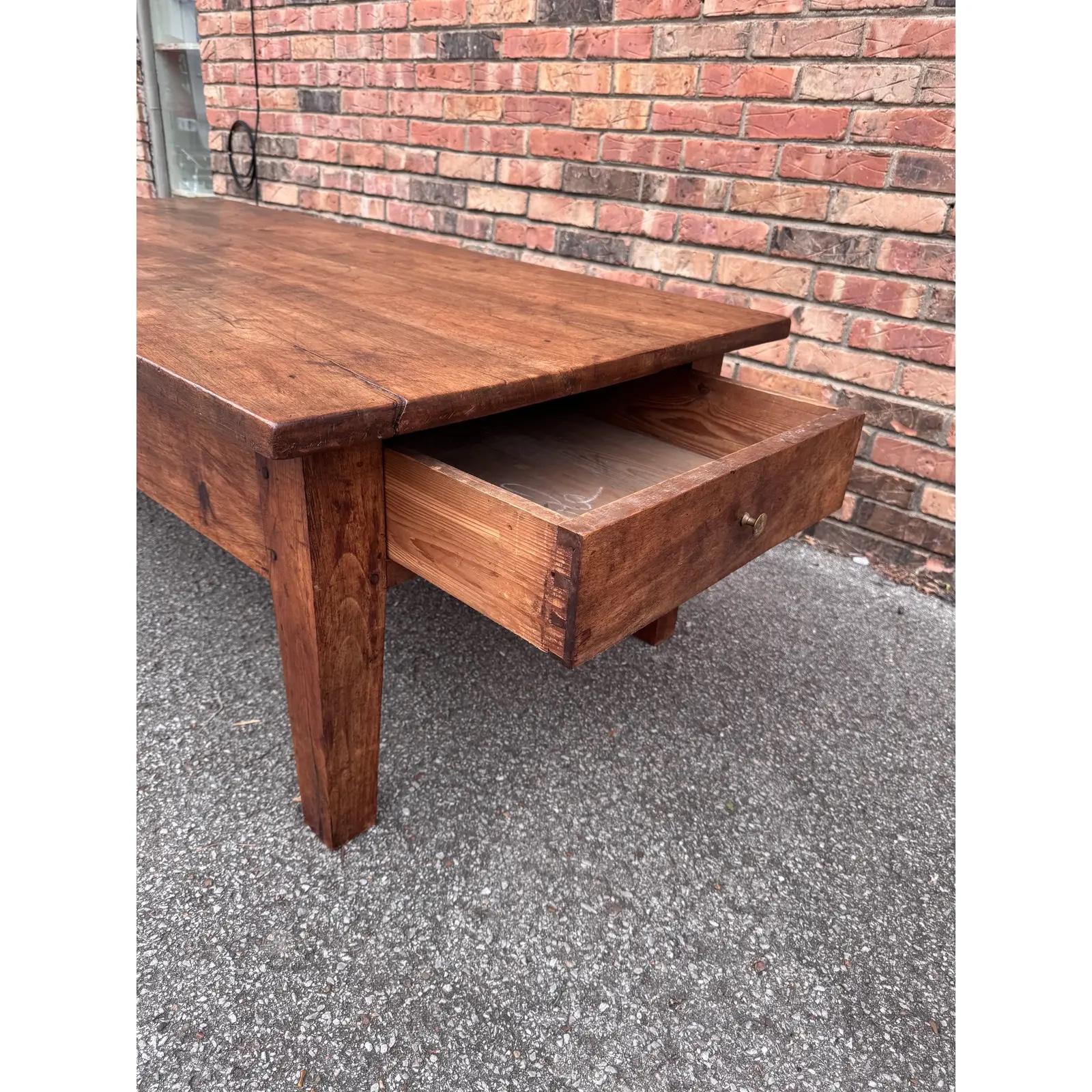 This is a really lovely 19th century French coffee table. This simple and beautifully made in France, what was a stand up work table has been cut down to coffee table height this table has two drawers one on each end that provides excellent storage.