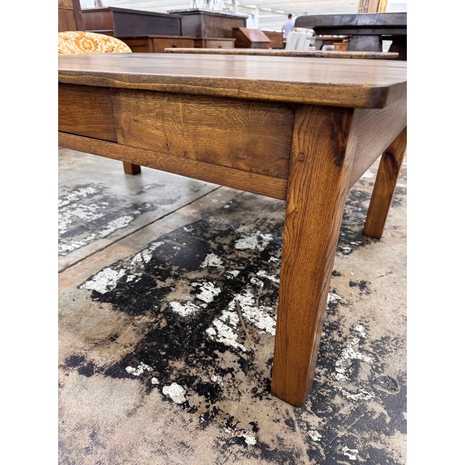 This 19th century coffee table has lovely character and patina! This piece is French country resting on 4 Tapered legs. There is a drawer at the front of the table that adds such an adorable charm to the table. This would be perfect for any room