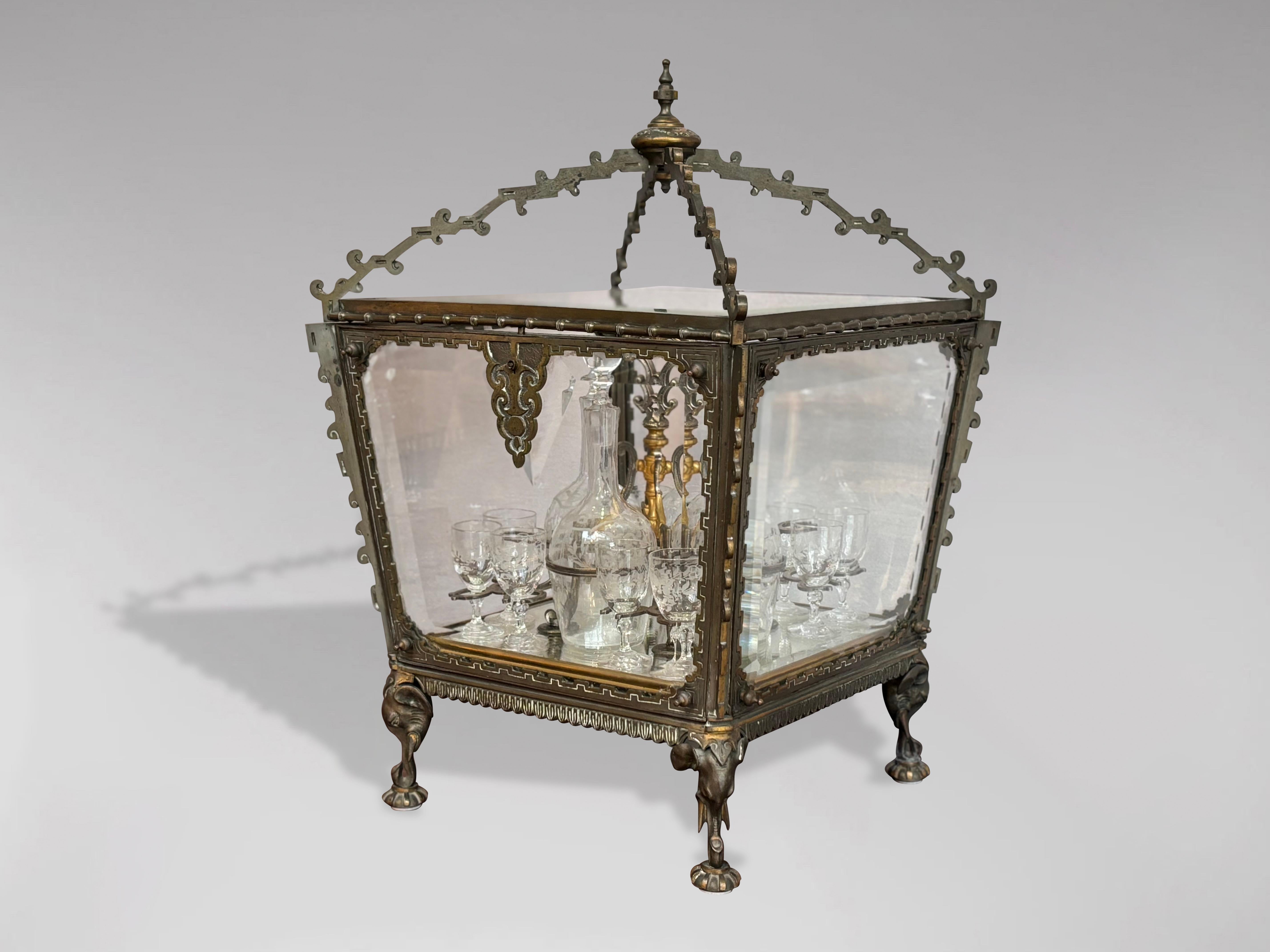 A fabulous French 19th century colonial, ormolu and bevelled glass cave à liqueur. The decorative case has bevelled glass panels on all sides and top, raised on 4 legs with sculptured elephant heads. The original beveled glass sides and top are also