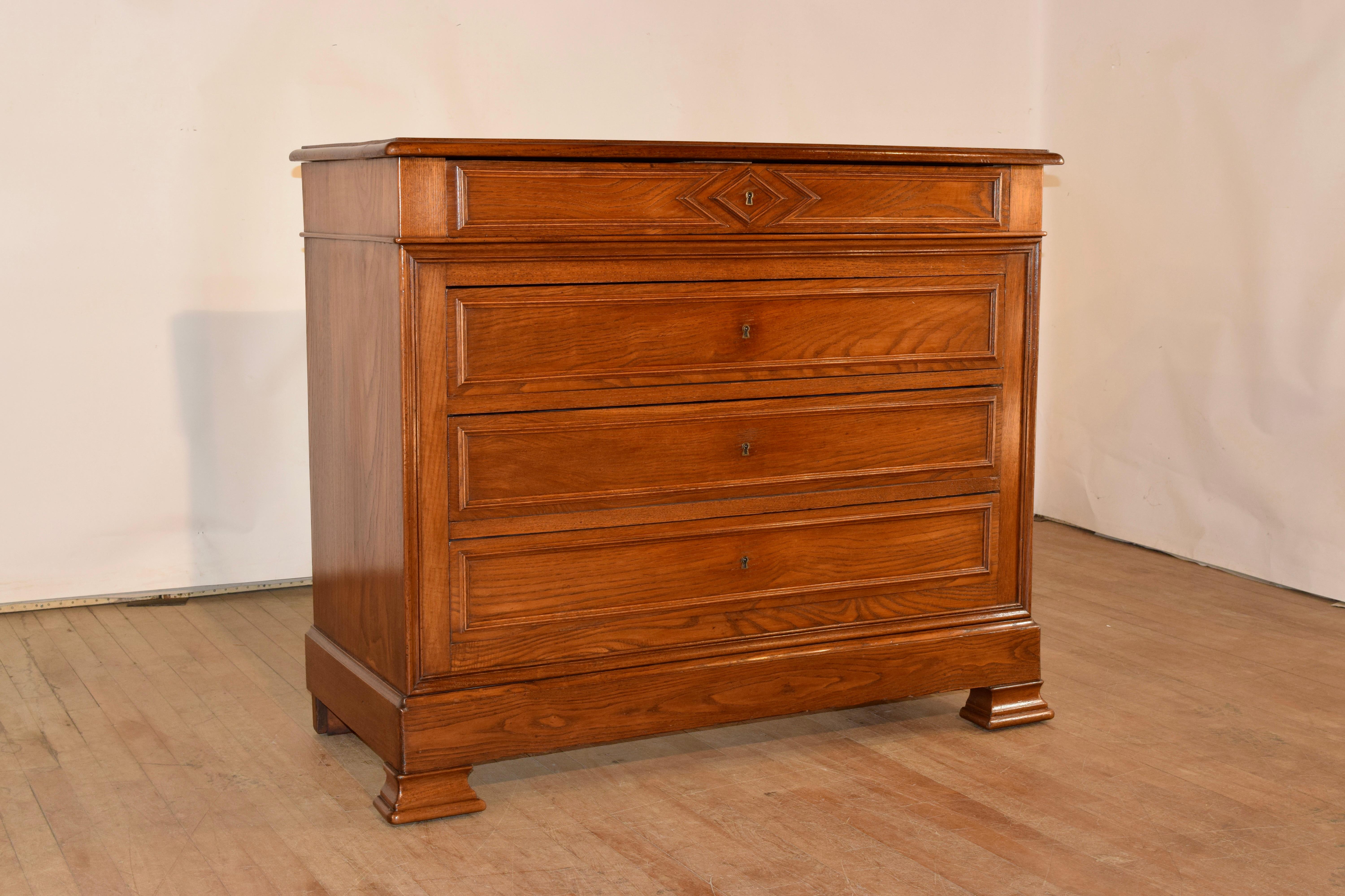 19th century Louis Philippe French commode made from Chestnut. The top is wonderfully grained and banded and has a beveled edge. The case has simple and elegant sides and for drawers in the front, all with molded decoration and a lovely banded base,