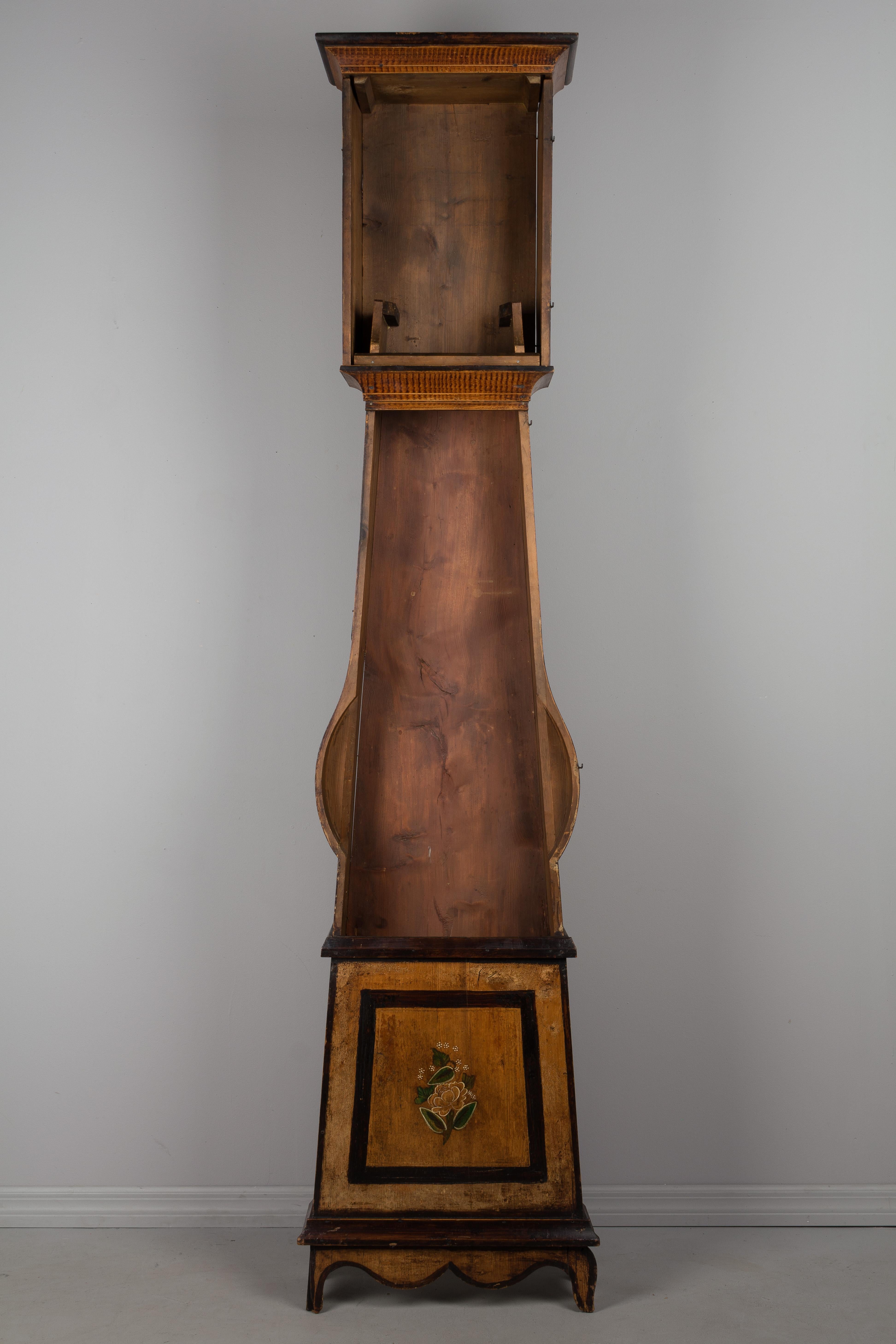 A French country comtoise, or grandfather clock, with polychrome painted pine case and embossed pendulum. Original seven day Morbier movement, professionally cleaned and in working order, having an enamel face signed by the clockmaker, Billot at La